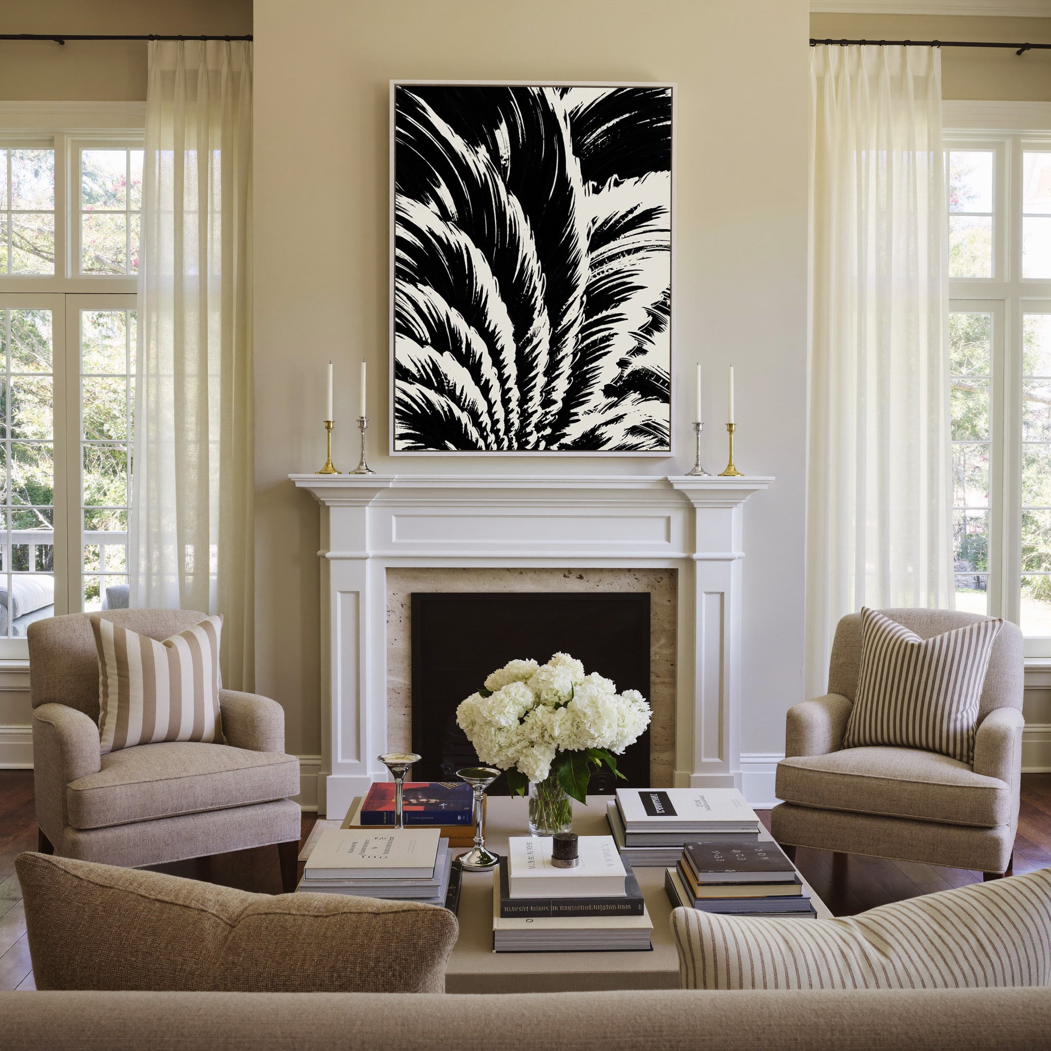 black and white palm leaf abstract canvas wall art in a white frame above a mantel