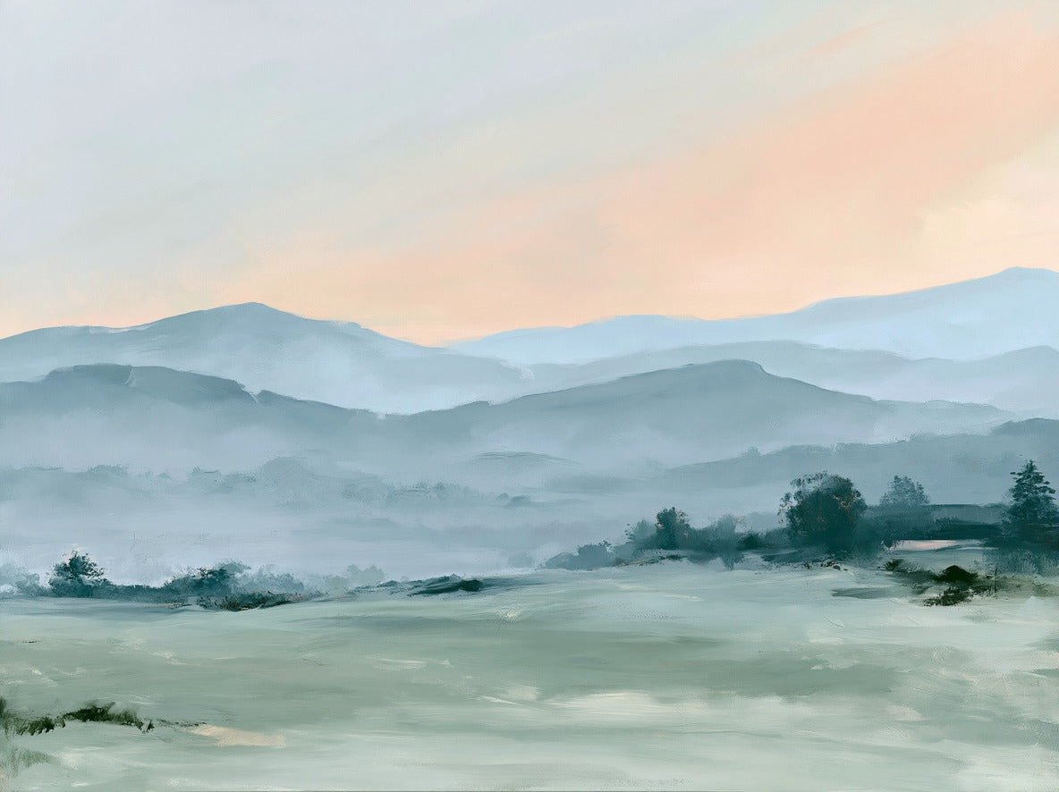 Misty blue hills layered across a pale field beneath a peach sky, soft horizontal landscape