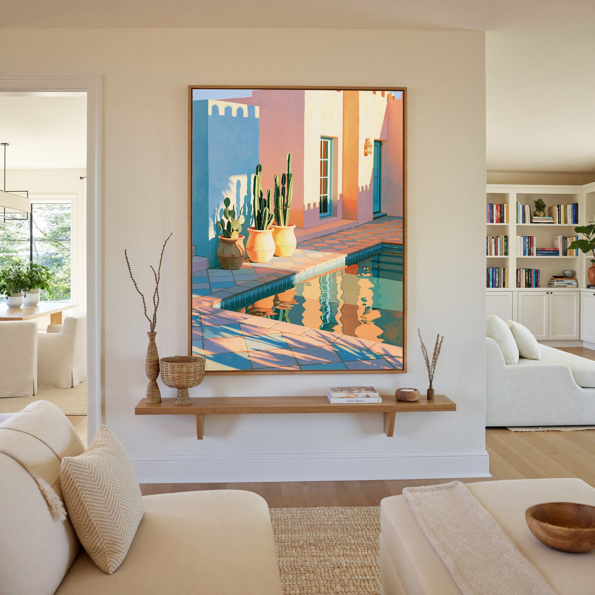 pastel courtyard with cactus pots and pool canvas wall art in an oak frame in a living room