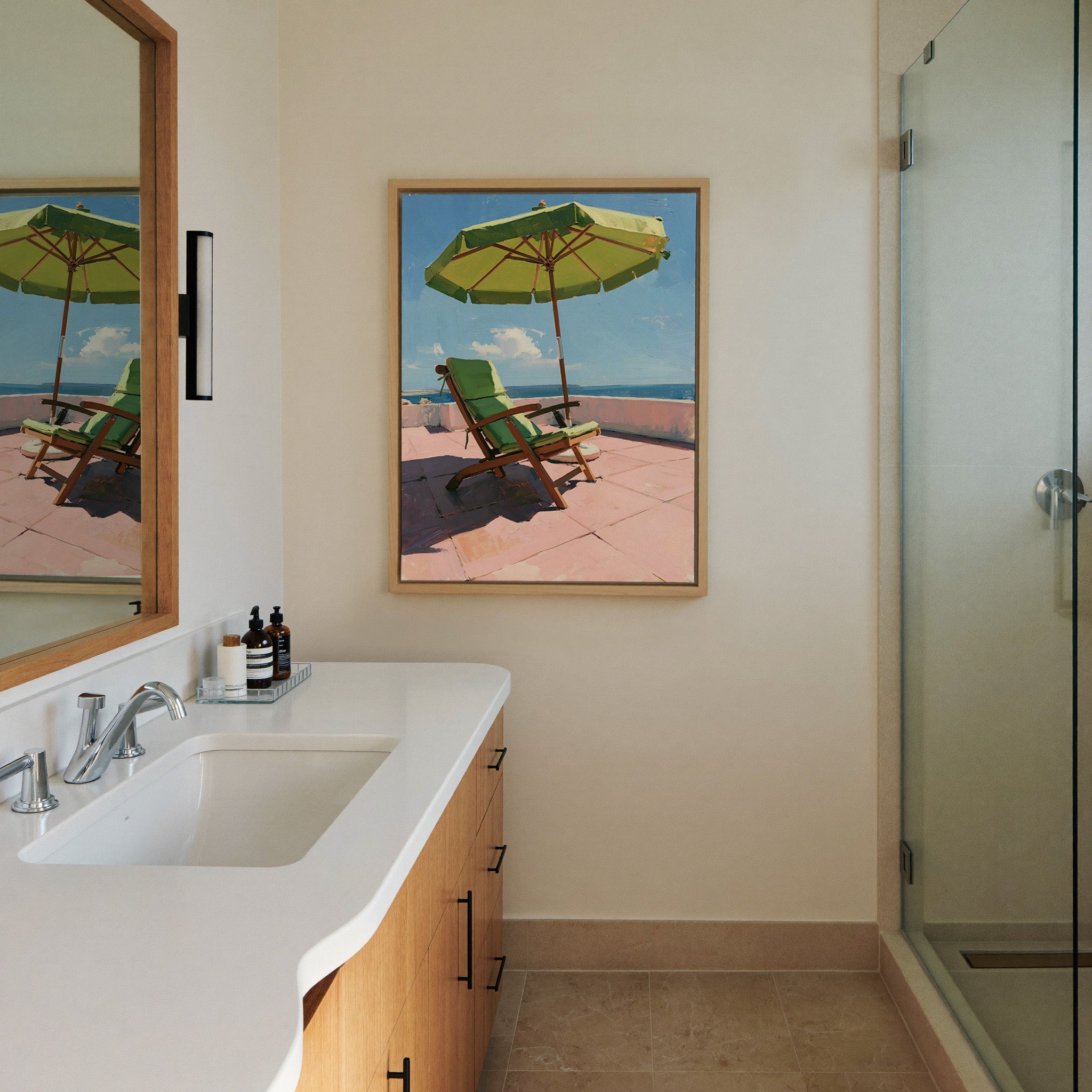 green umbrella and chair on a pink terrace canvas wall art in a natural wood frame in a styled room setting