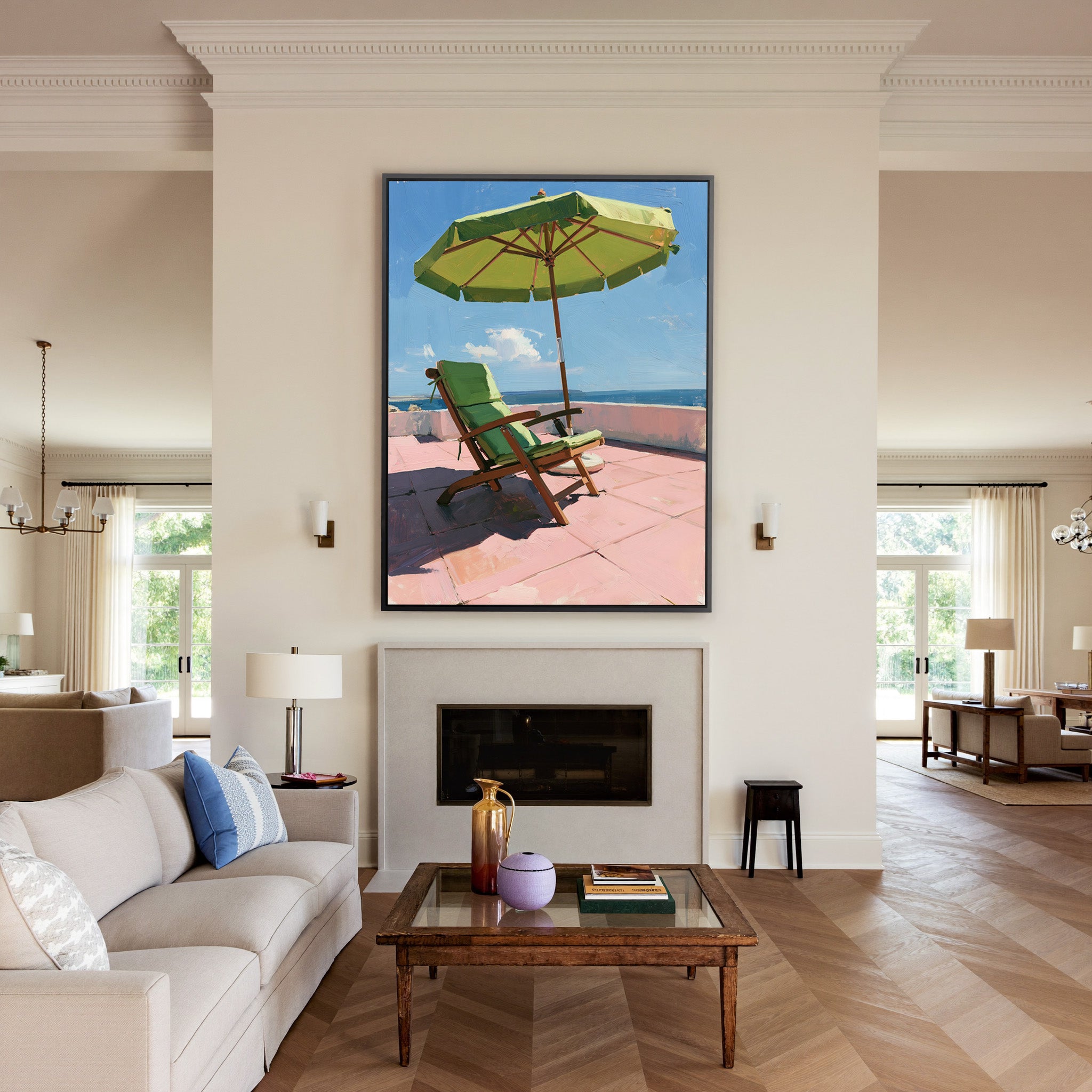 green umbrella and chair on a pink terrace canvas wall art in a black frame above a mantel