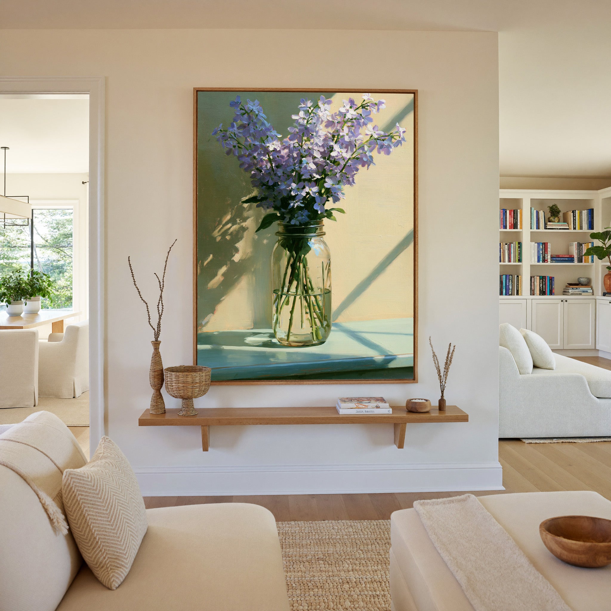 pale lavender flowers in a glass jar with soft canvas wall art in an oak frame in a living room