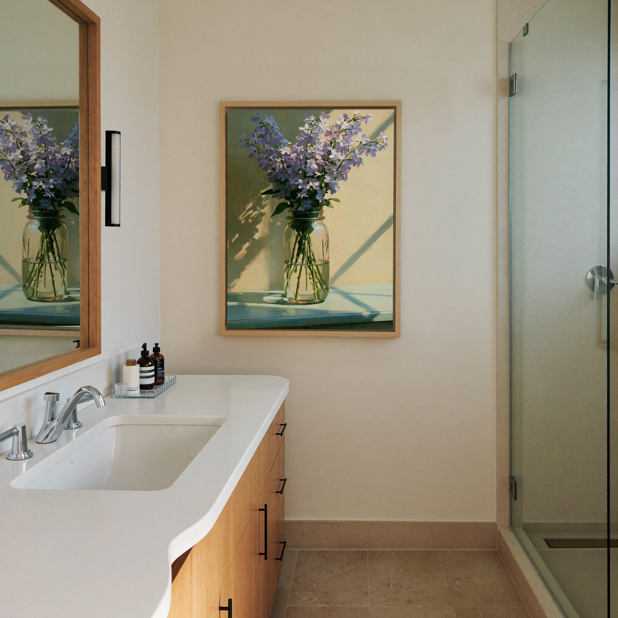 pale lavender flowers in a glass canvas wall art in a natural wood frame in a styled room setting