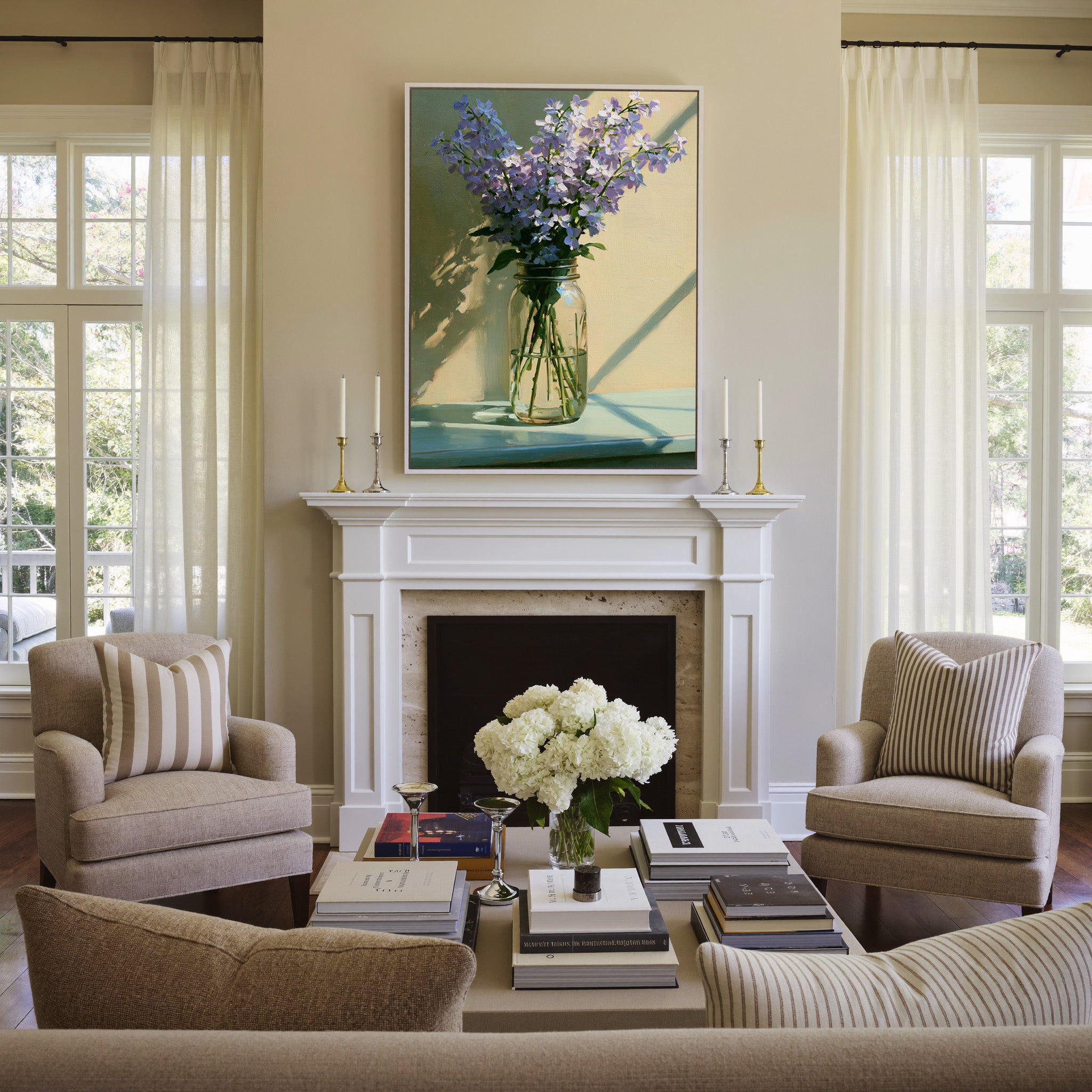 pale lavender flowers in a glass jar with soft canvas wall art in a white frame above a mantel