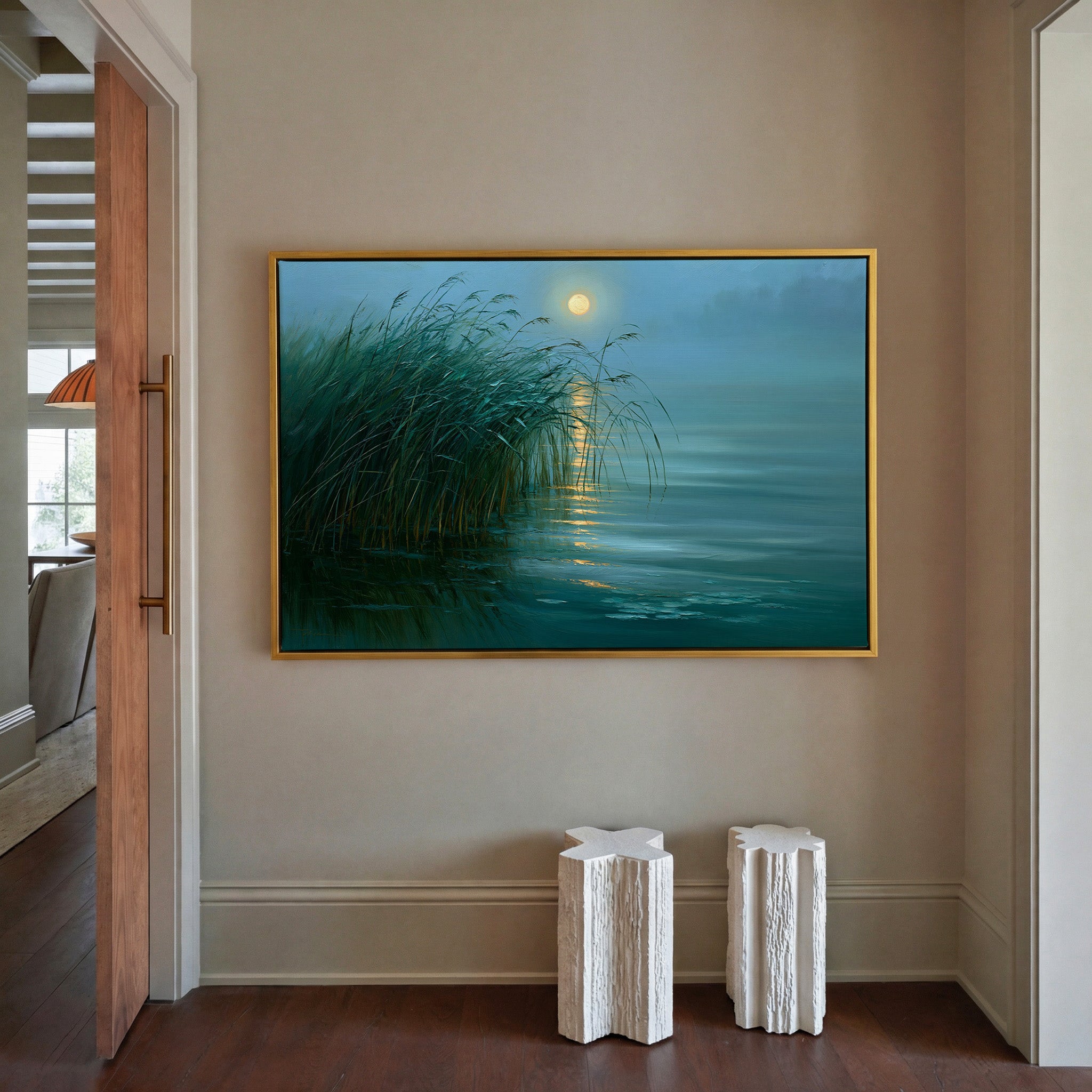 teal lake with reeds and gold moon reflection canvas wall art in a gold frame in a styled room setting
