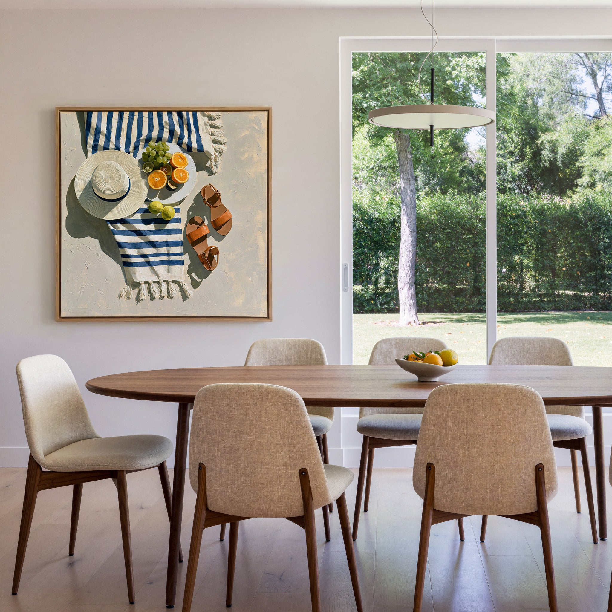 blue striped towel with citrus, hat, and sandals canvas wall art in an oak frame in a dining room