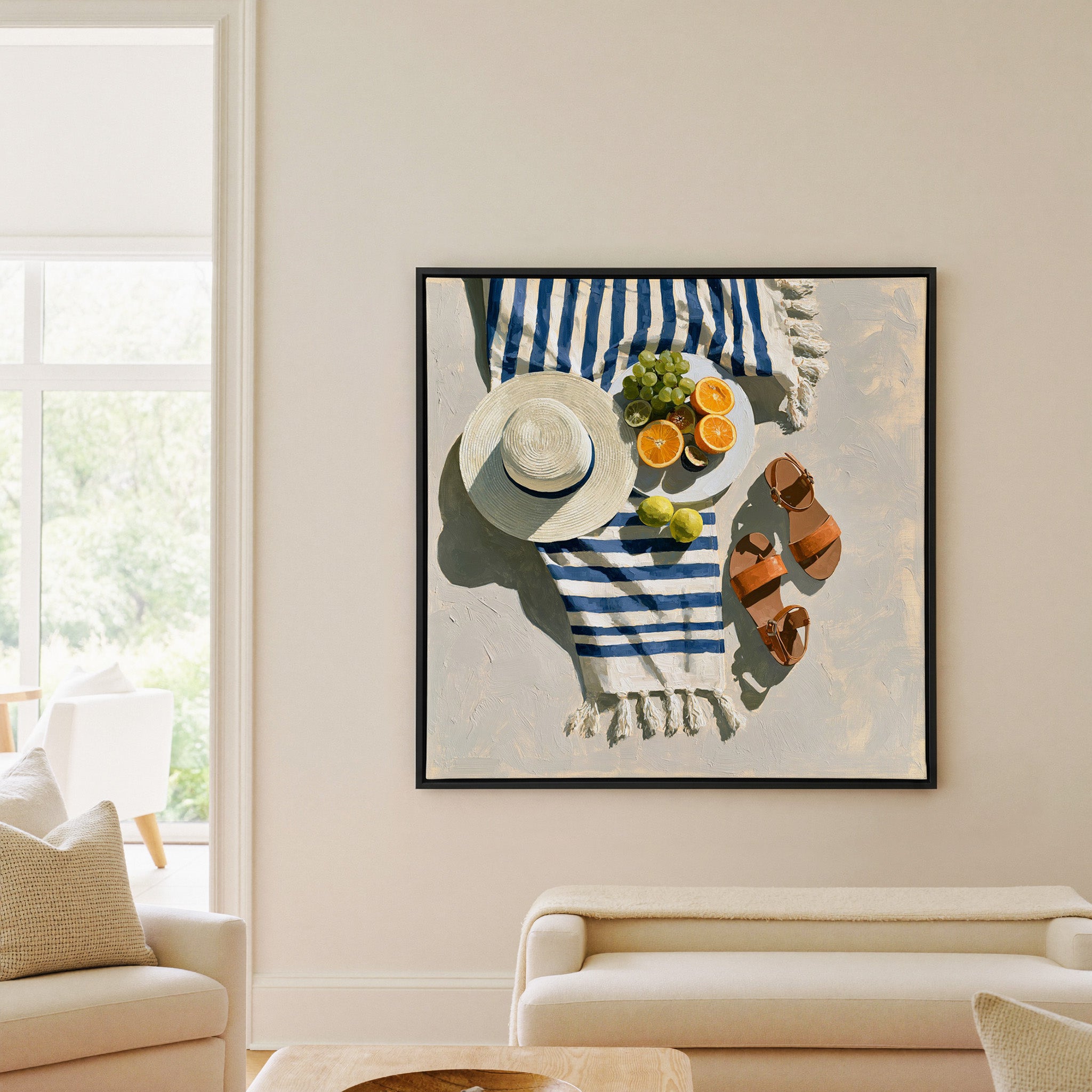 blue striped towel with citrus, hat, and sandals canvas wall art in a black frame in a living room