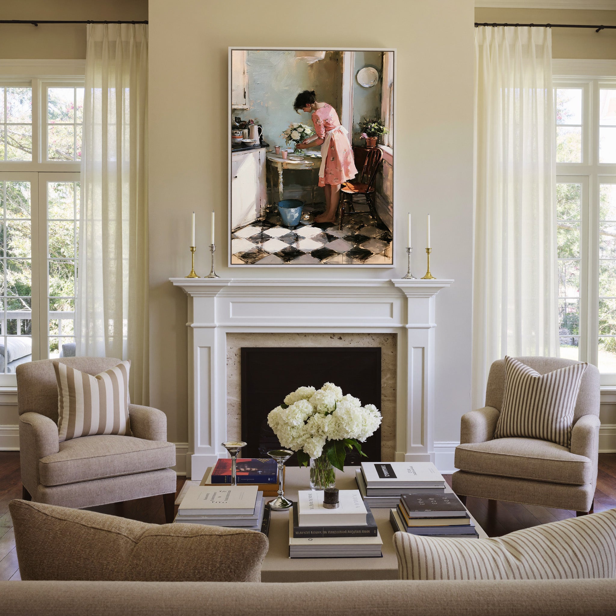 woman in a pink dress arranging white flowers canvas wall art in a white frame above a mantel