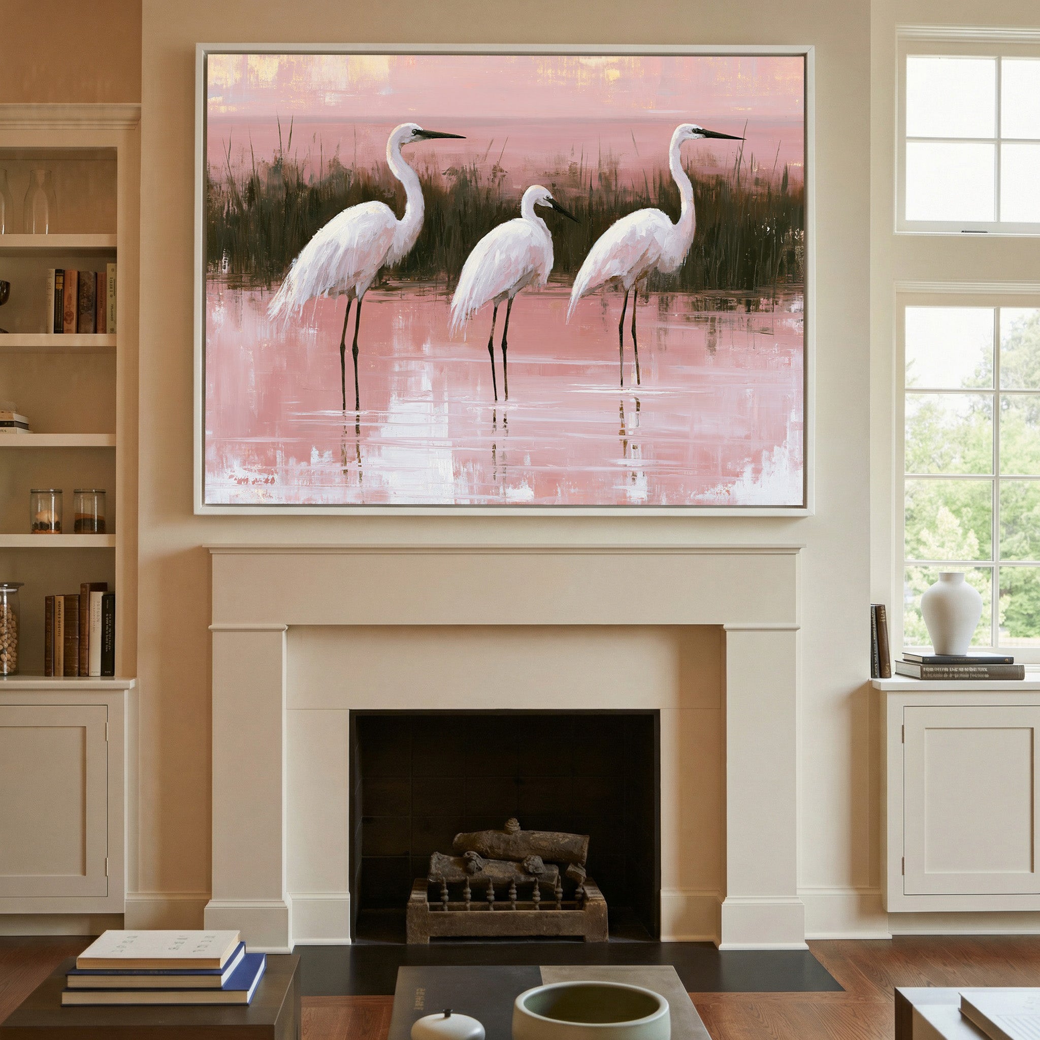 white egrets in shallow pink water canvas wall art in a white frame above a mantel