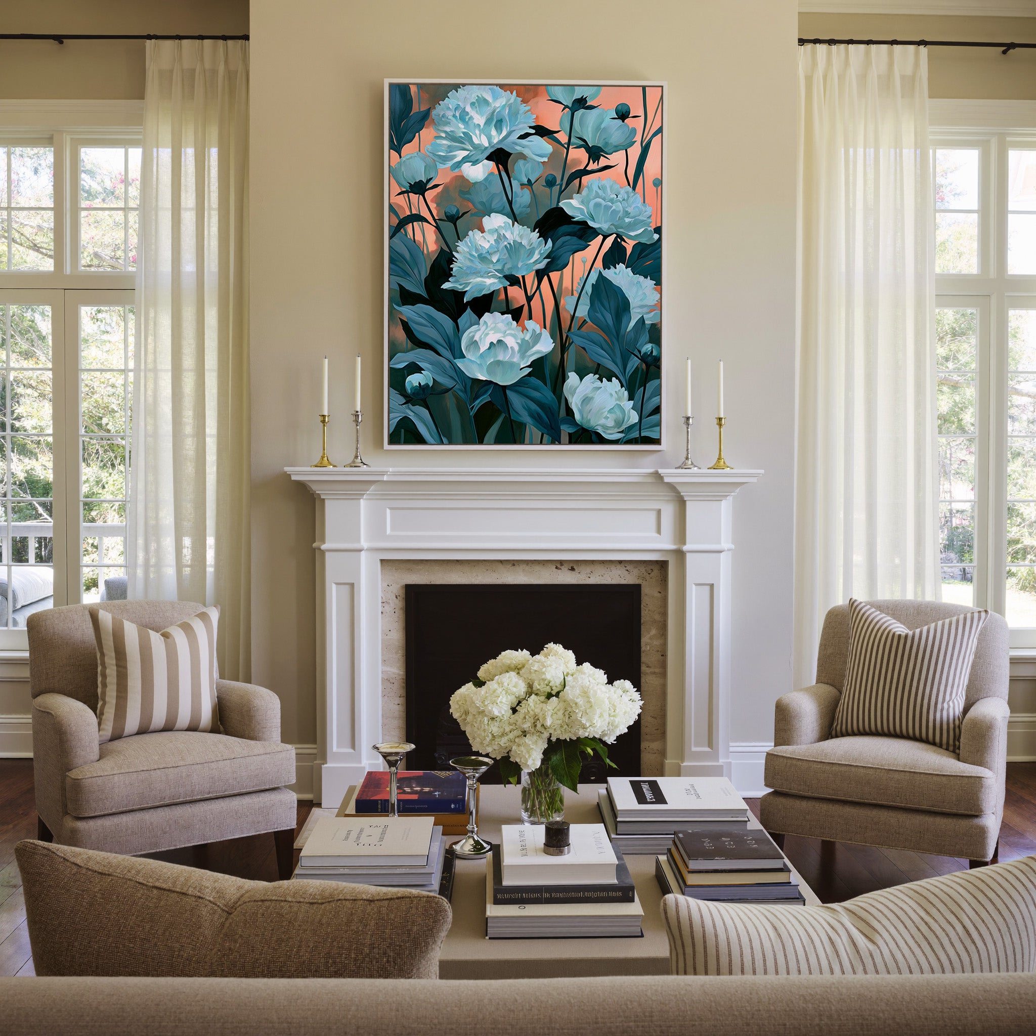 white flowers with teal leaves on a coral dusk canvas wall art in a white frame above a mantel