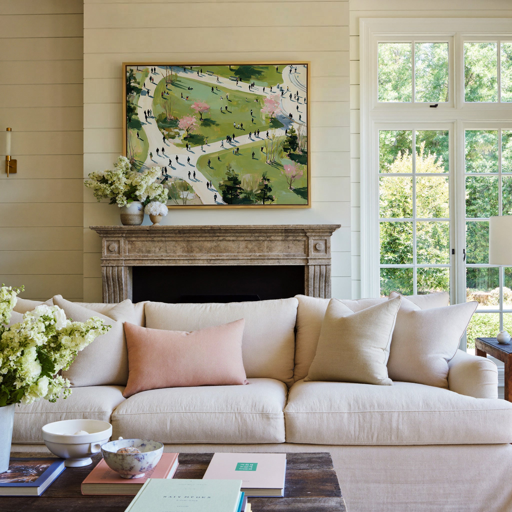 green park with winding paths and scattered canvas wall art in a gold frame above a mantel