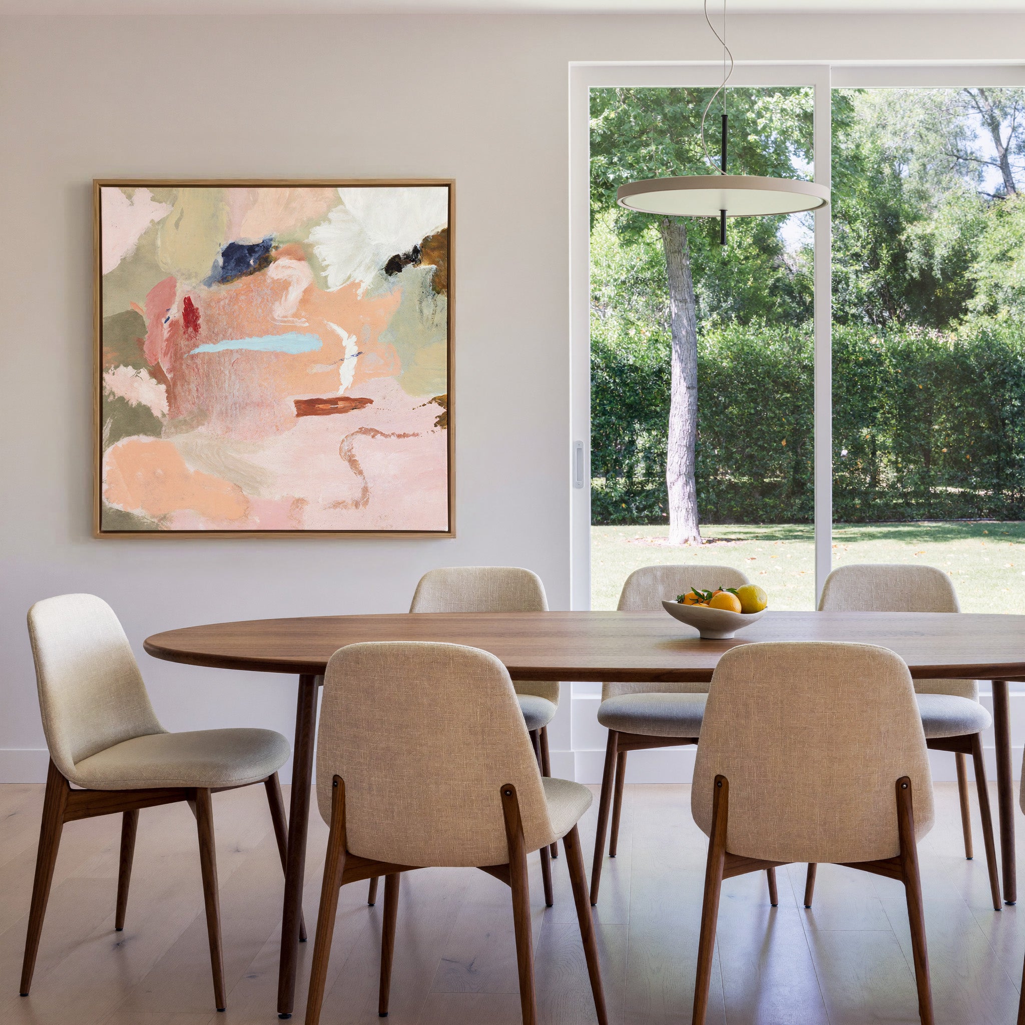soft peach and blush abstract with cream, sage, canvas wall art in an oak frame in a dining room