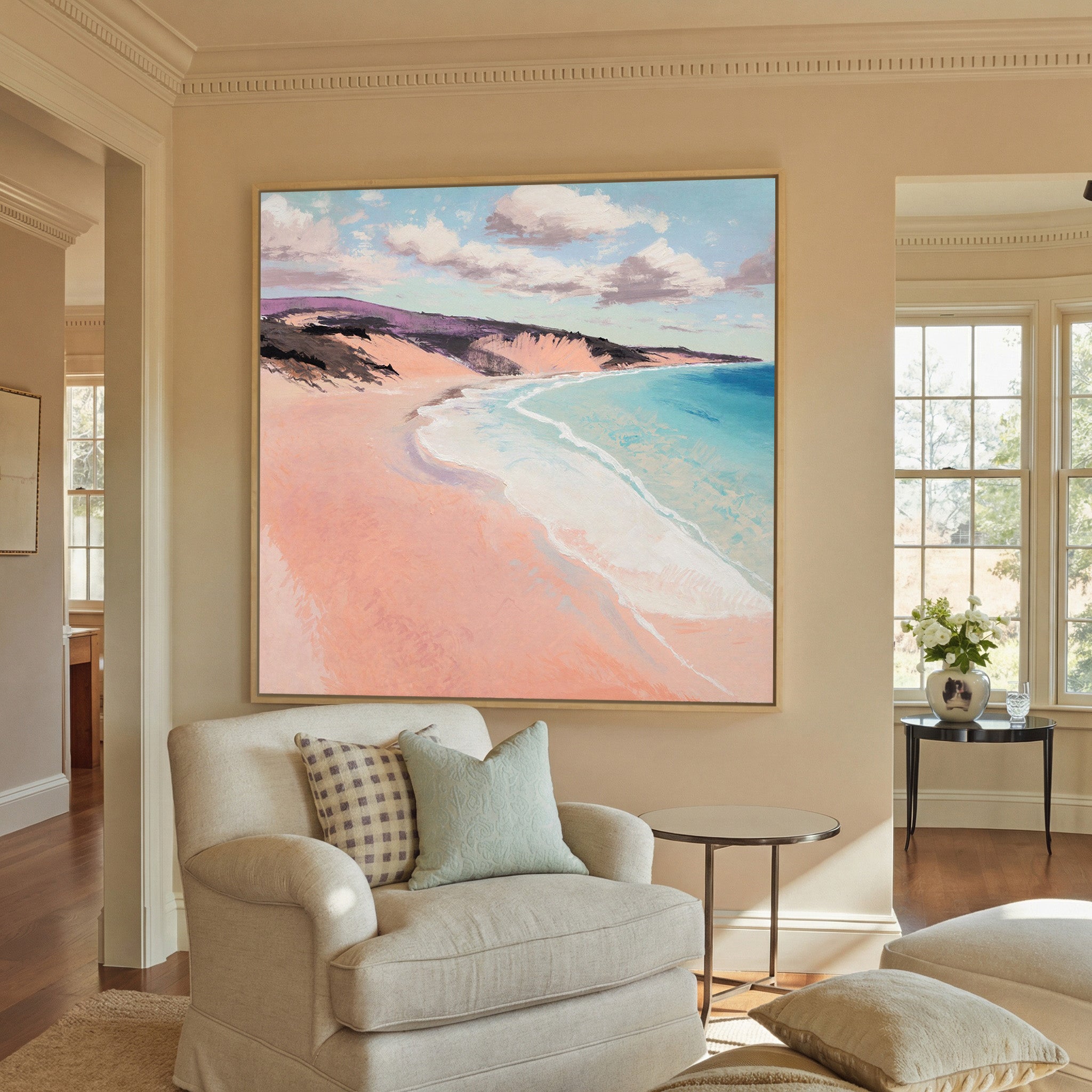 soft peach beach with turquoise water and canvas wall art in a natural wood frame in a styled room setting