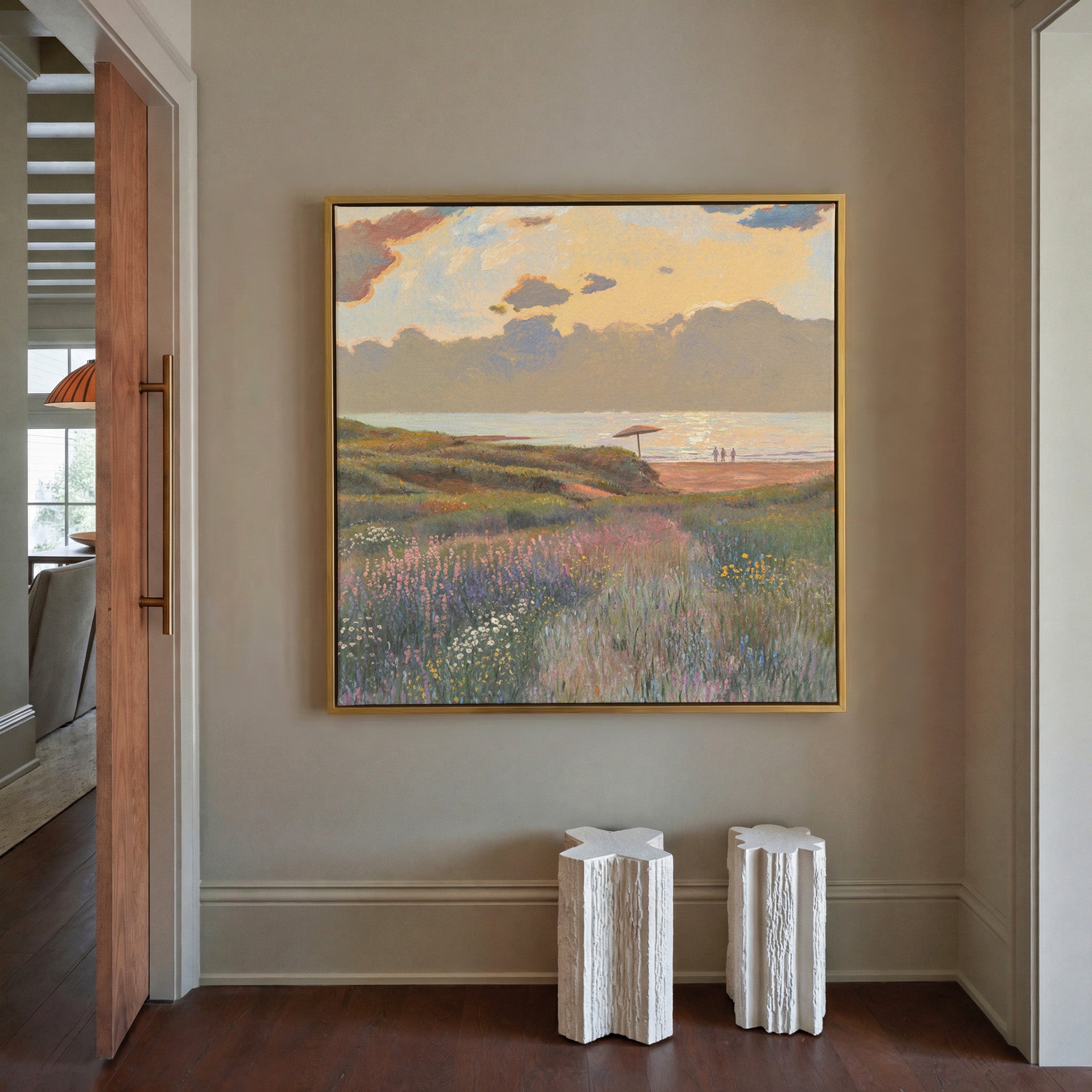 soft coastal meadow with pastel wildflowers and canvas wall art in a gold frame in a styled room setting