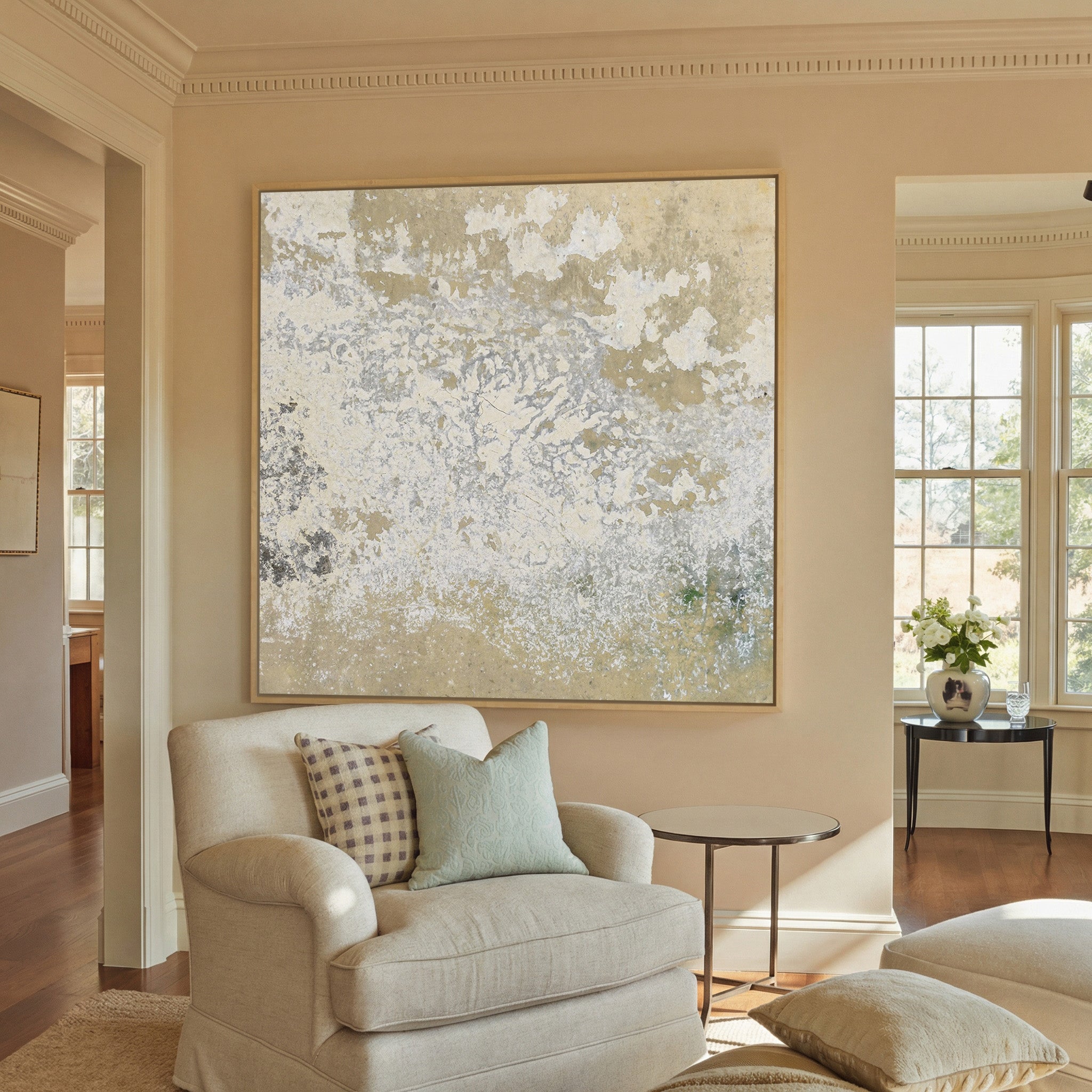 weathered cream and taupe abstract canvas wall art in a natural wood frame in a styled room setting
