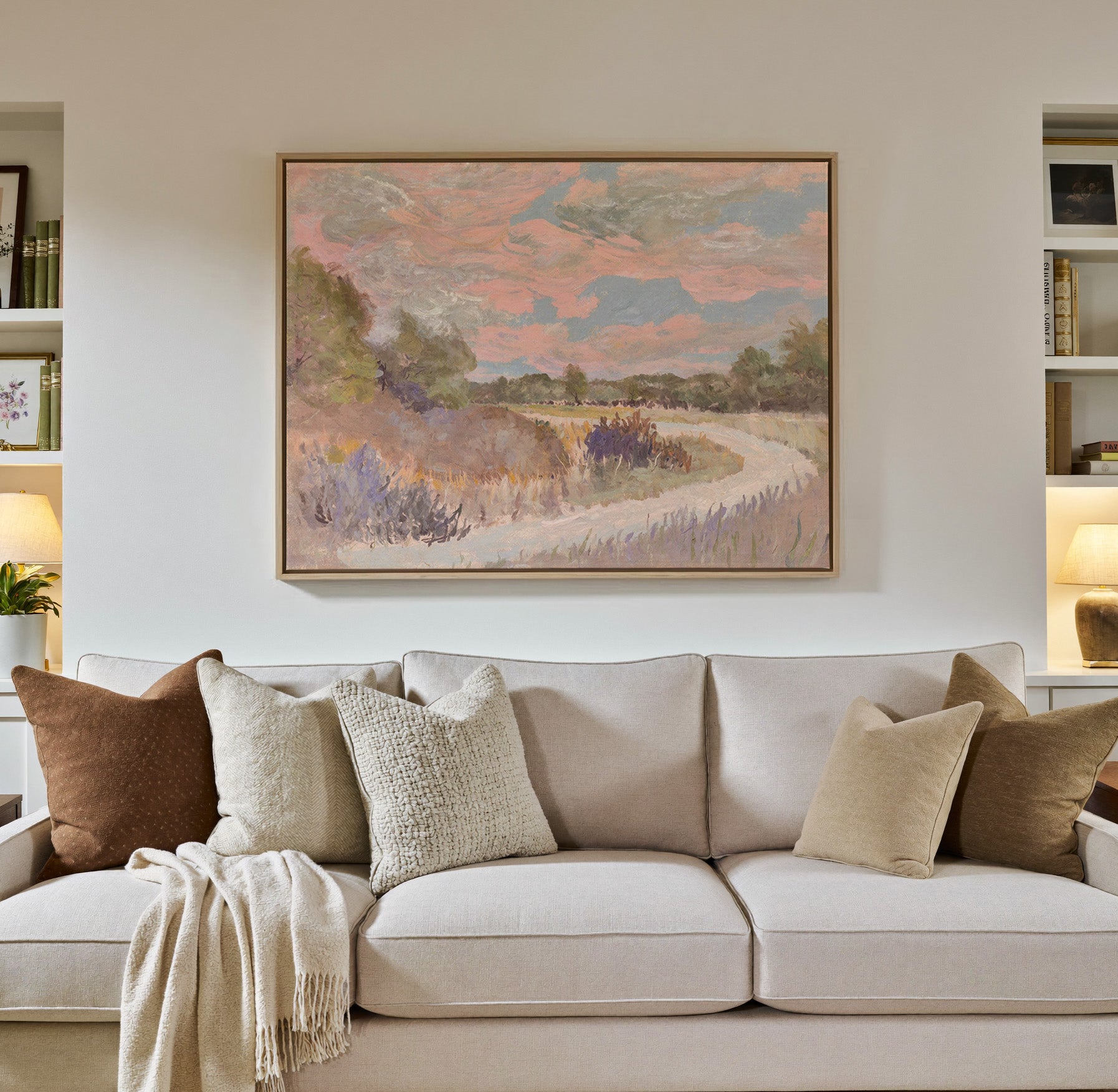 pastel meadow path with pink sky and lavender canvas wall art in a natural wood frame in a styled room setting
