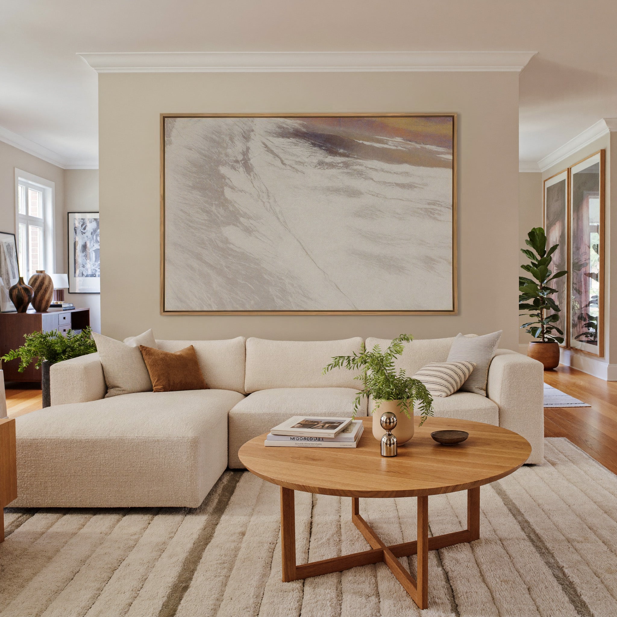 warm beige abstract with sweeping diagonal canvas wall art in an oak frame in a living room