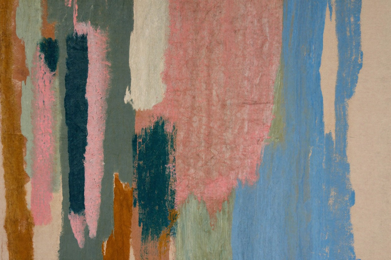 Vertical pink, blue, teal, and rust bands on a cream ground with narrow open gaps