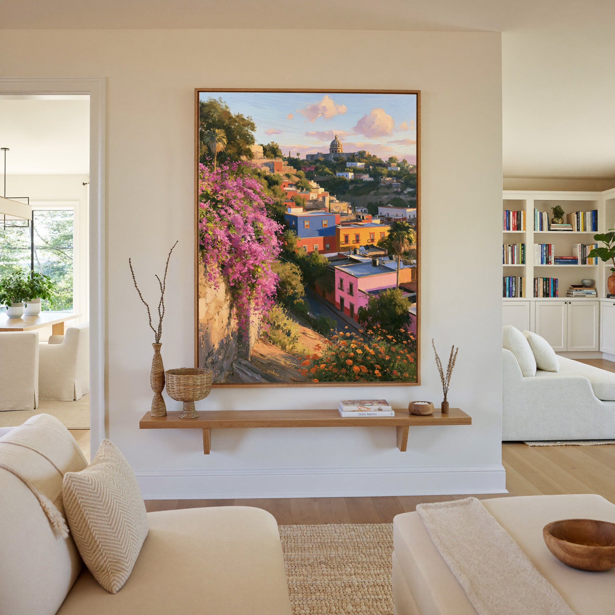 colorful hillside town with a domed church and canvas wall art in an oak frame in a living room