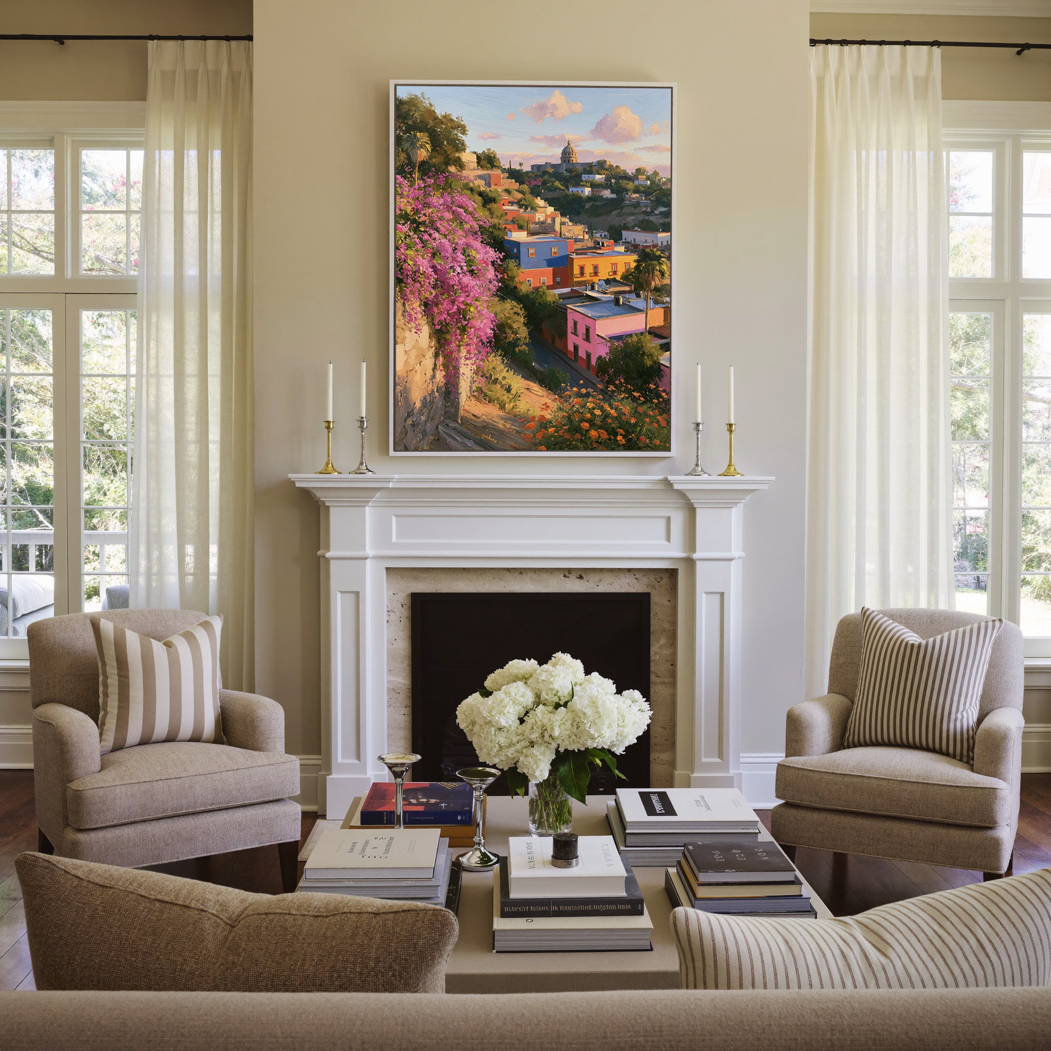 colorful hillside town with a domed church and canvas wall art in a white frame above a mantel