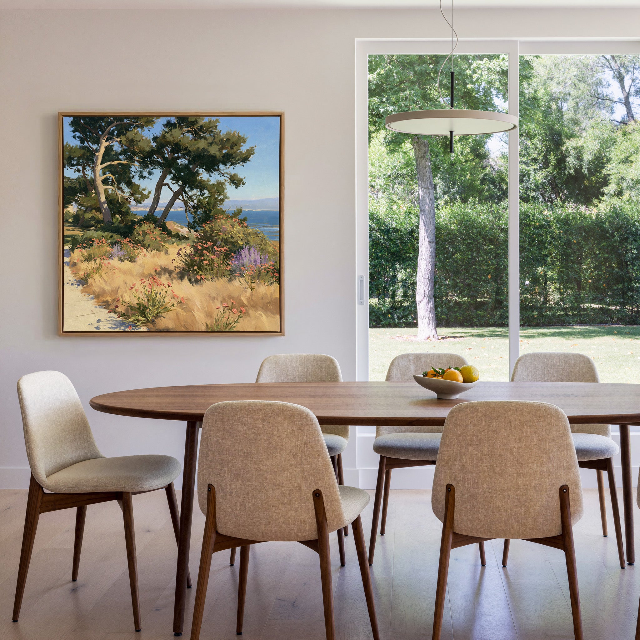 coastal garden with wind shaped cypress, dry canvas wall art in an oak frame in a dining room