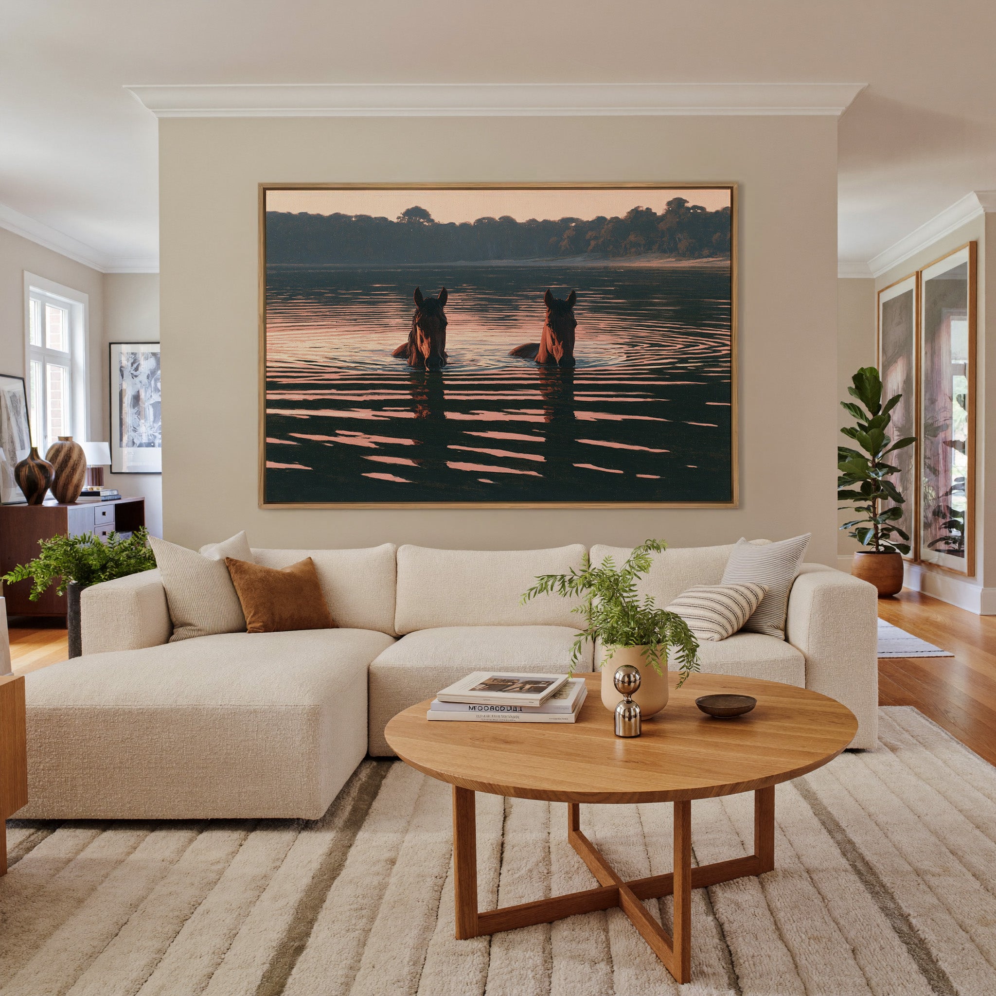 two brown horses wading in dark water at sunset canvas wall art in an oak frame in a living room