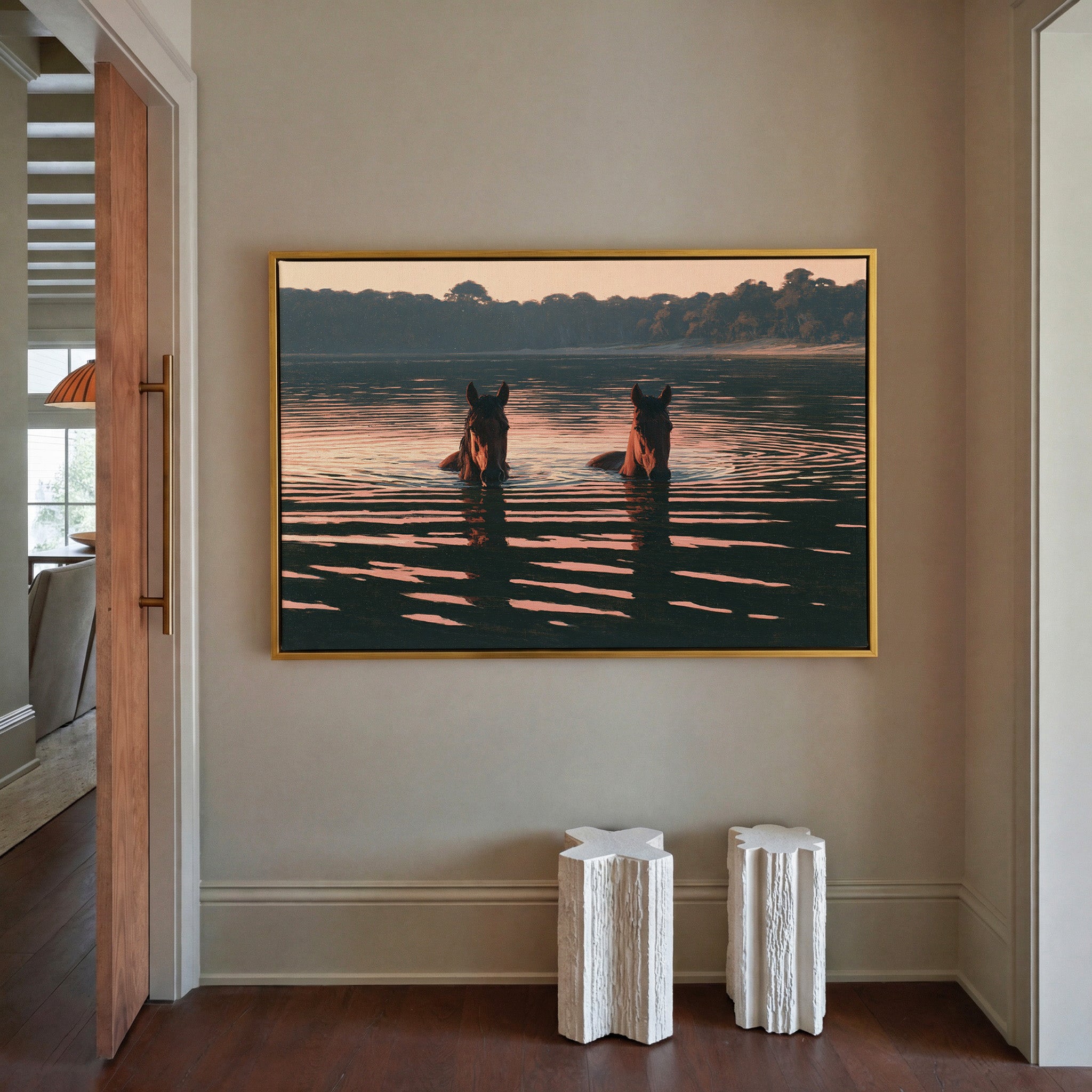 two brown horses wading in dark water at sunset canvas wall art in a gold frame in a styled room setting