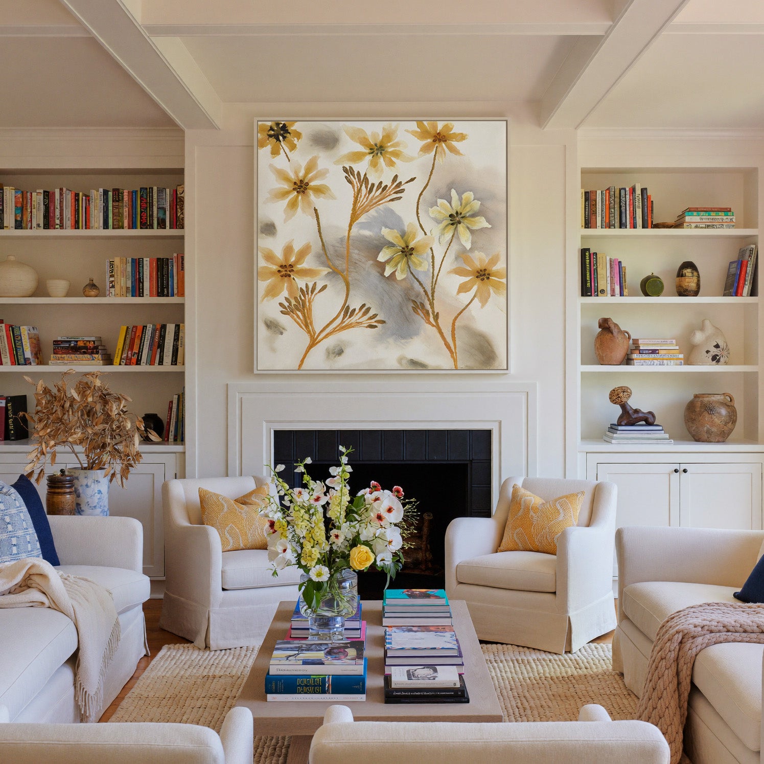 soft saffron and gray abstract floral forms canvas wall art in a white frame above a fireplace