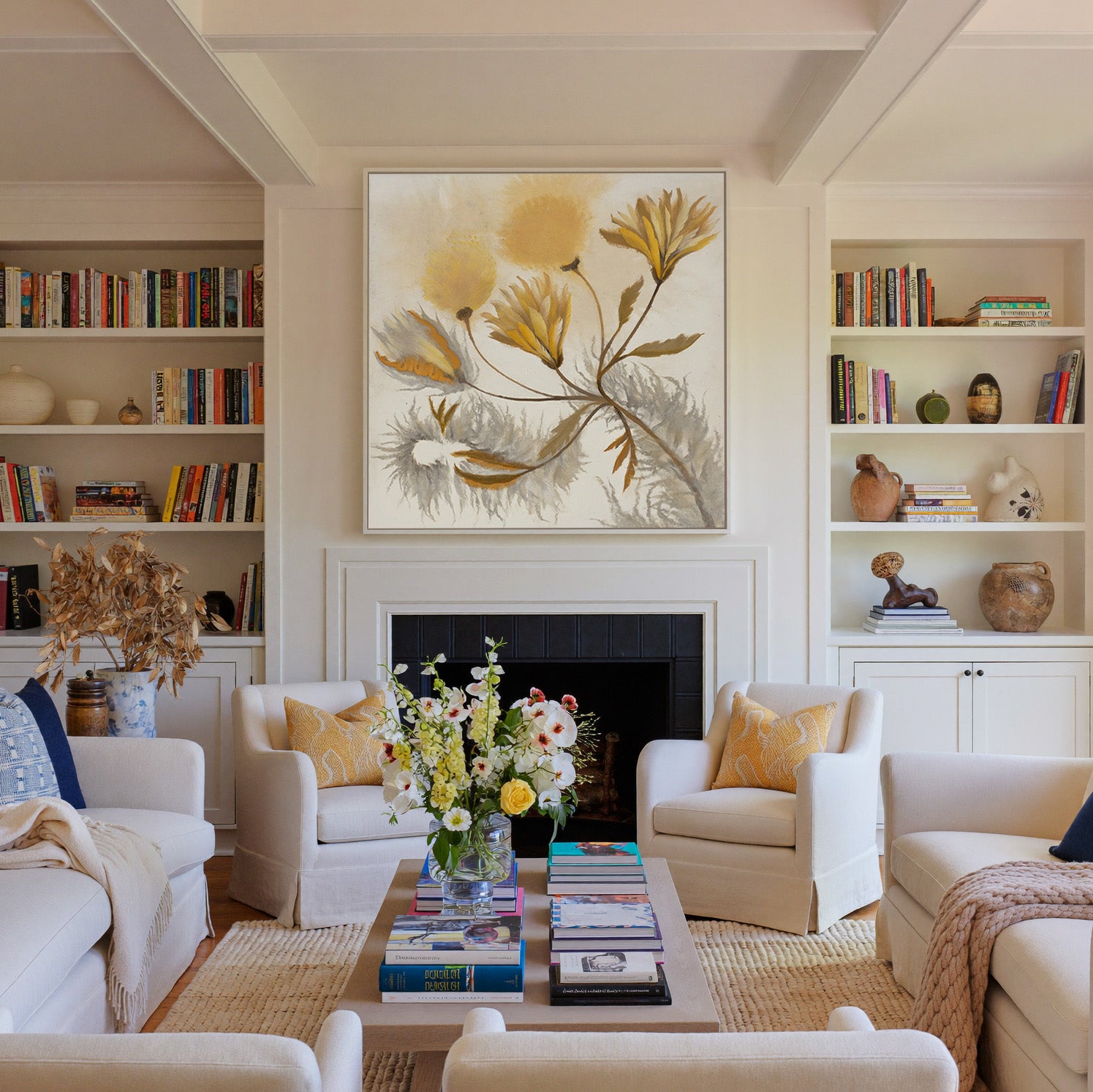 soft ochre and gray abstract canvas wall art in a white frame above a fireplace