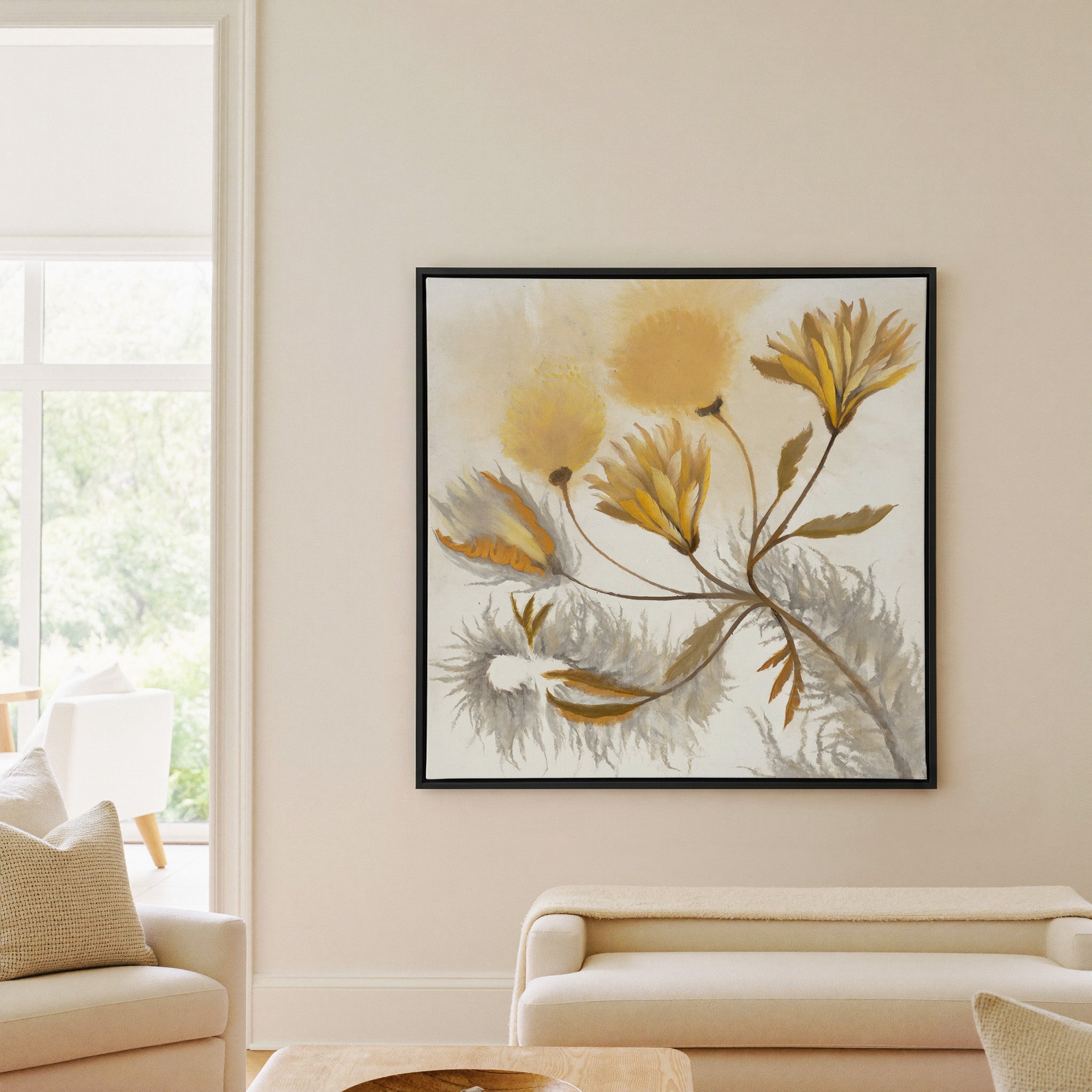 soft ochre and gray abstract canvas wall art in a black frame in a living room