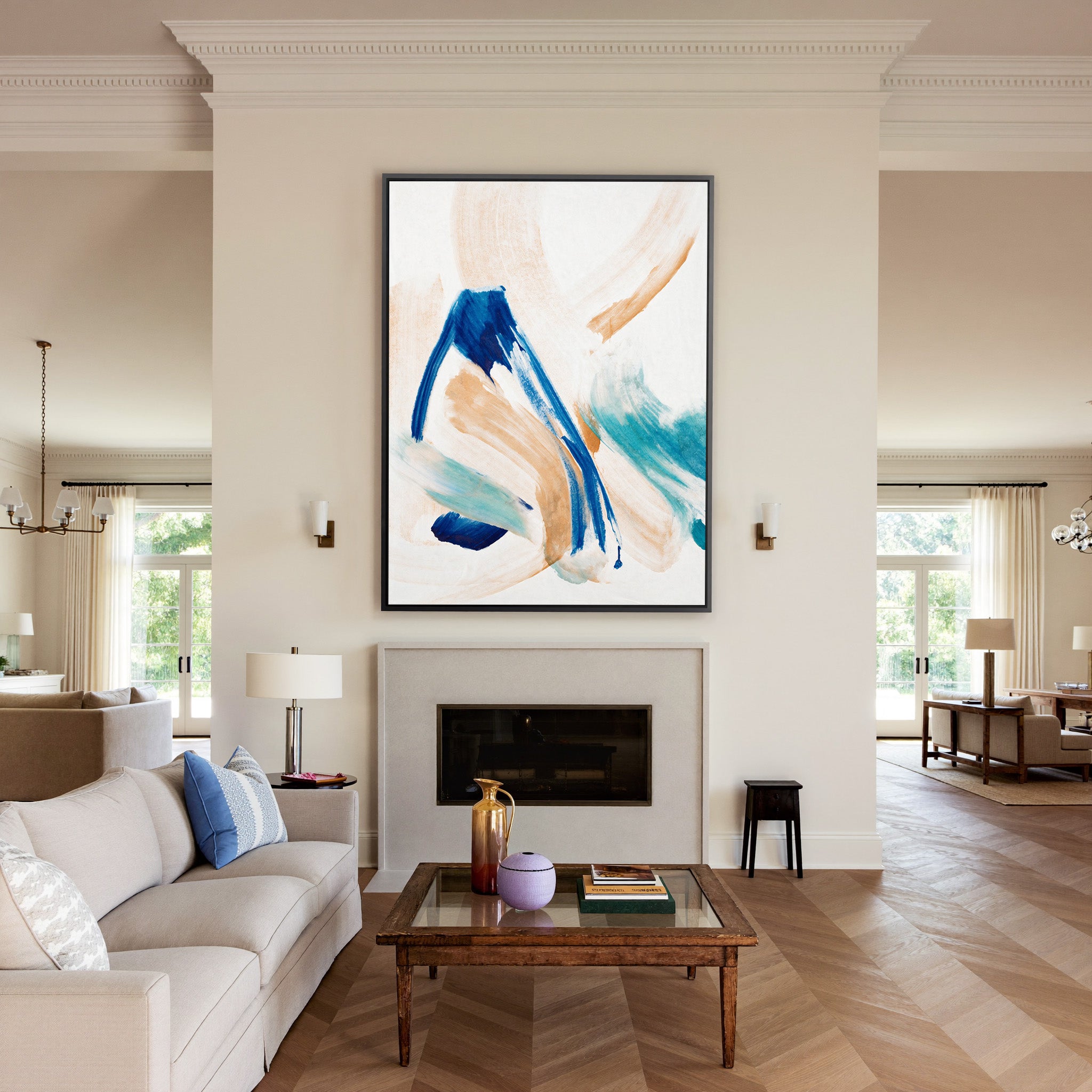 blue, aqua, and warm beige abstract with canvas wall art in a black frame above a mantel