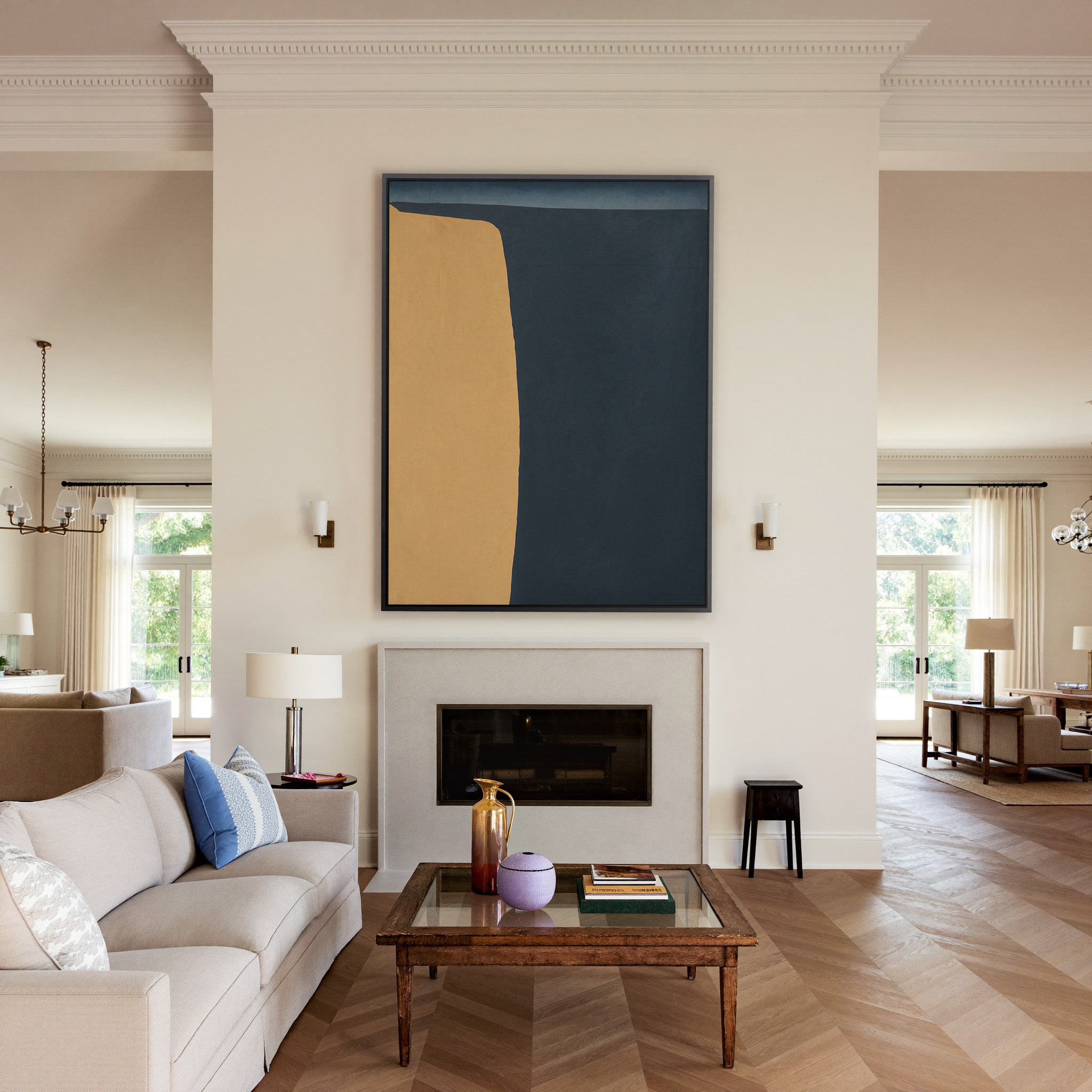 navy and ochre abstract with a tall curved block canvas wall art in a black frame above a mantel