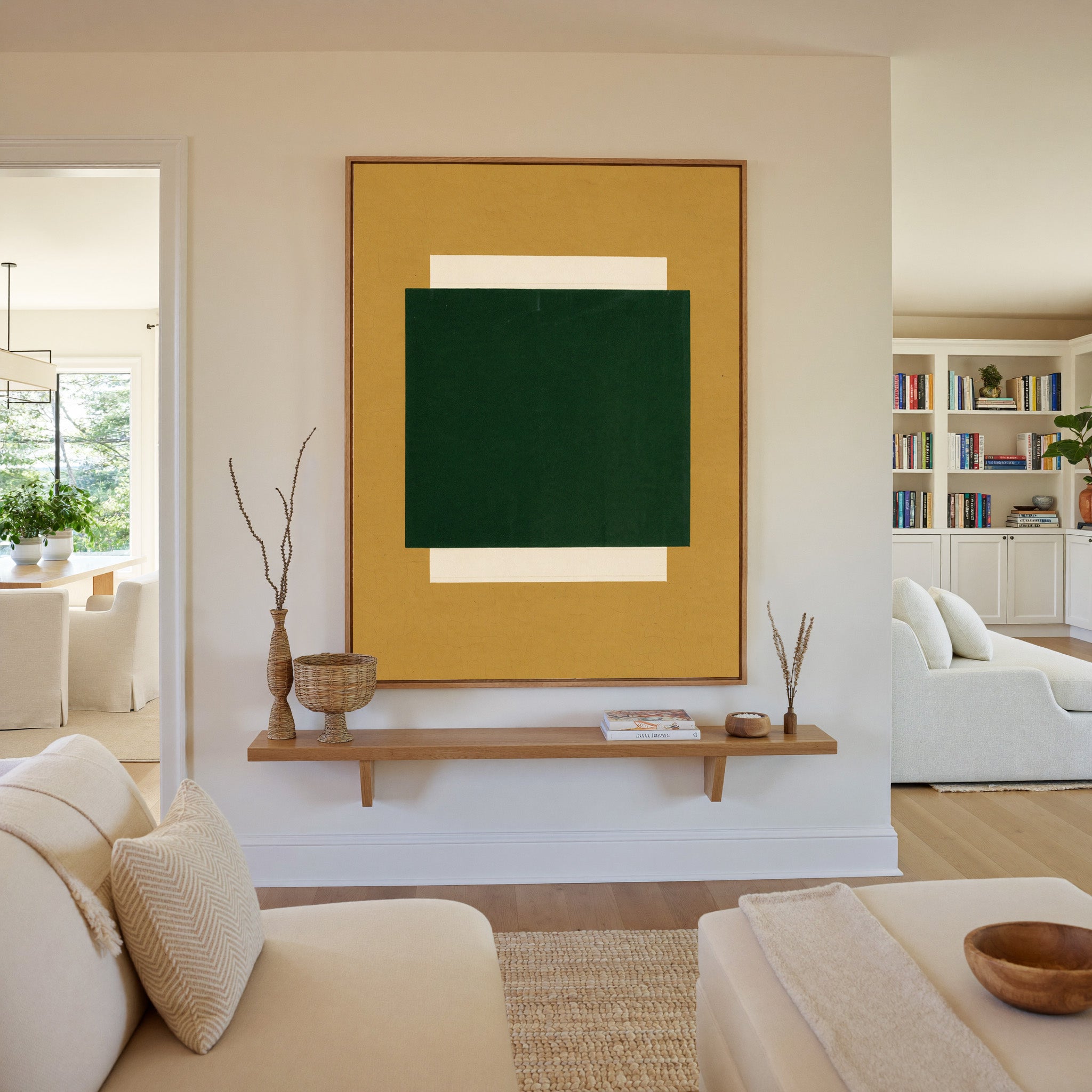 deep green block on ochre ground canvas wall art in an oak frame in a living room
