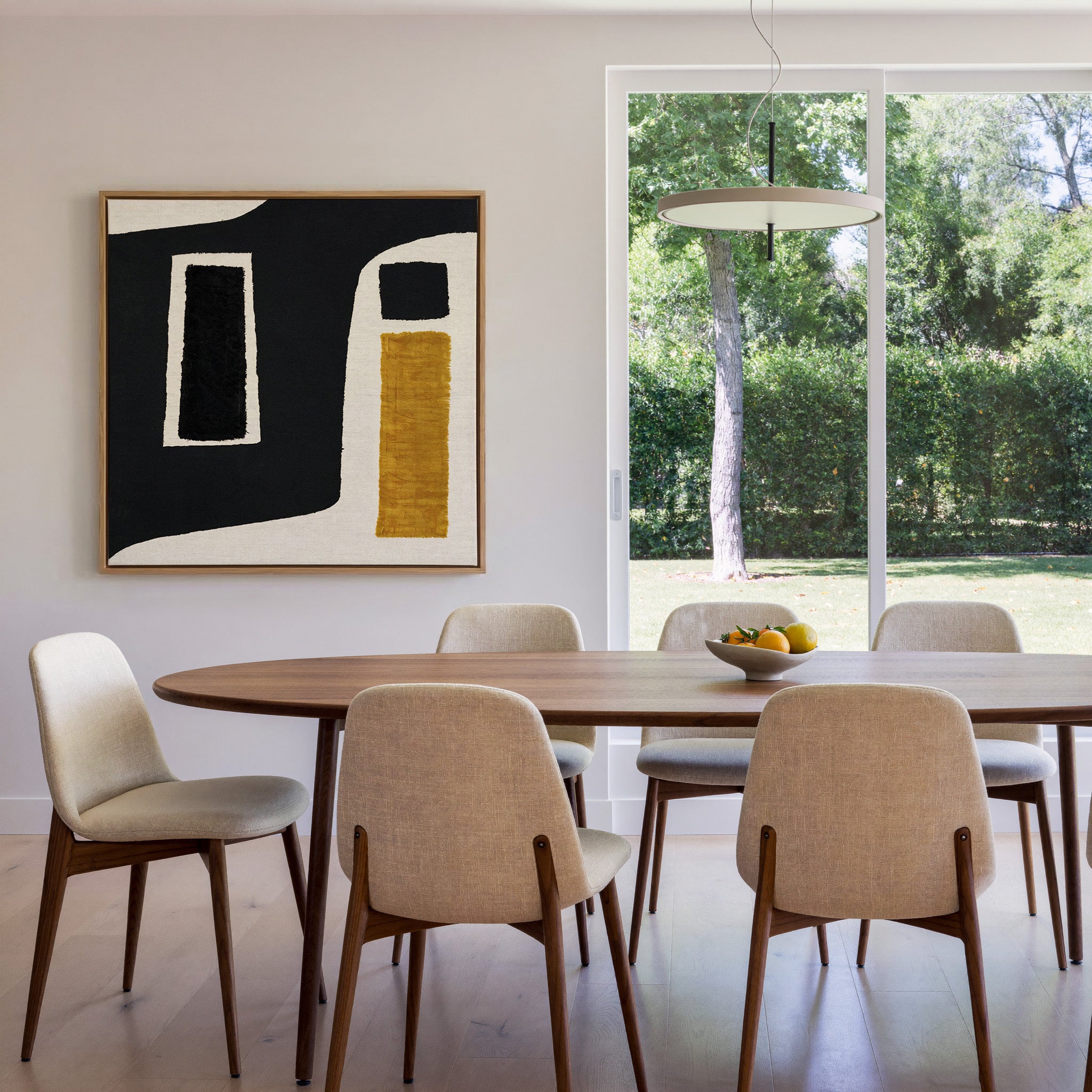 black and ochre abstract with framed blocks canvas wall art in an oak frame in a dining room