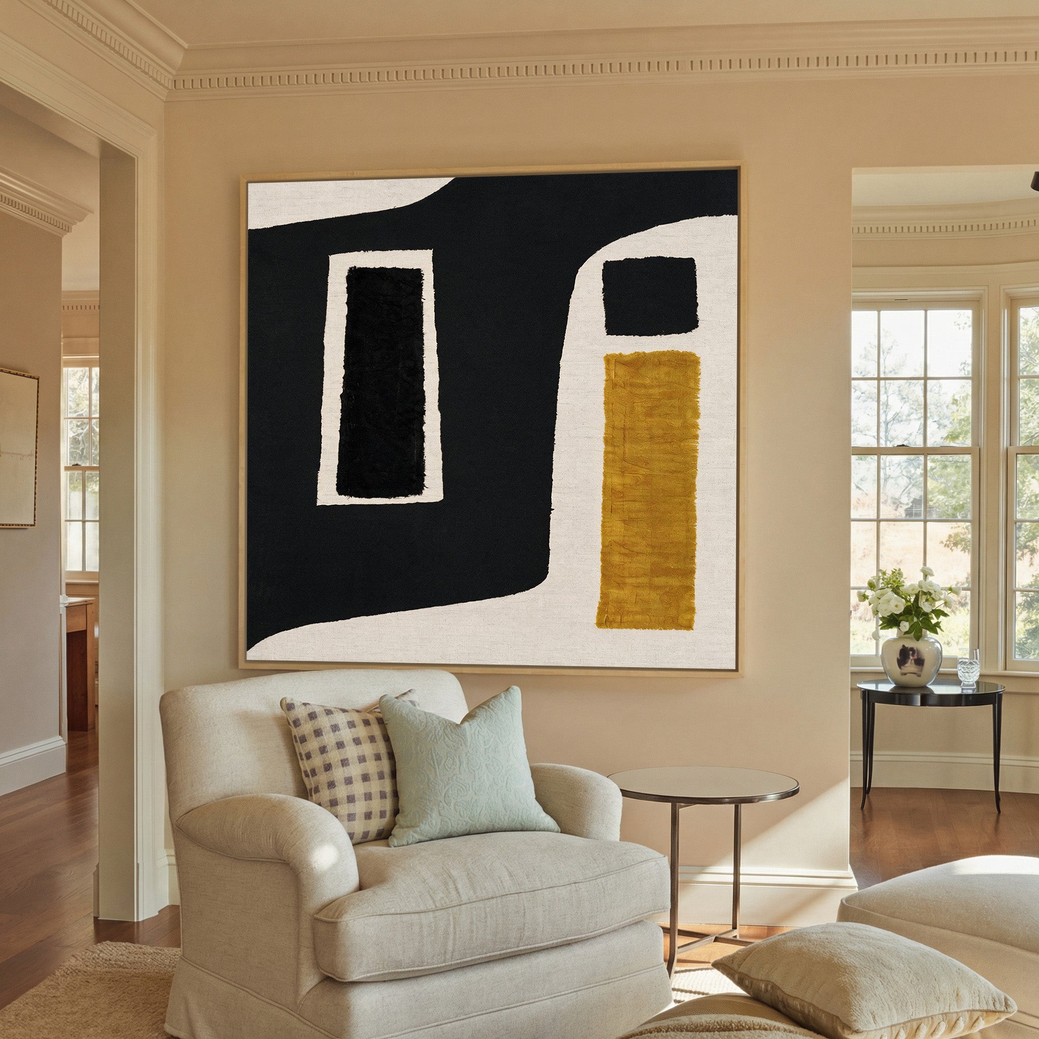 black and ochre abstract with framed blocks canvas wall art in a natural wood frame in a styled room setting