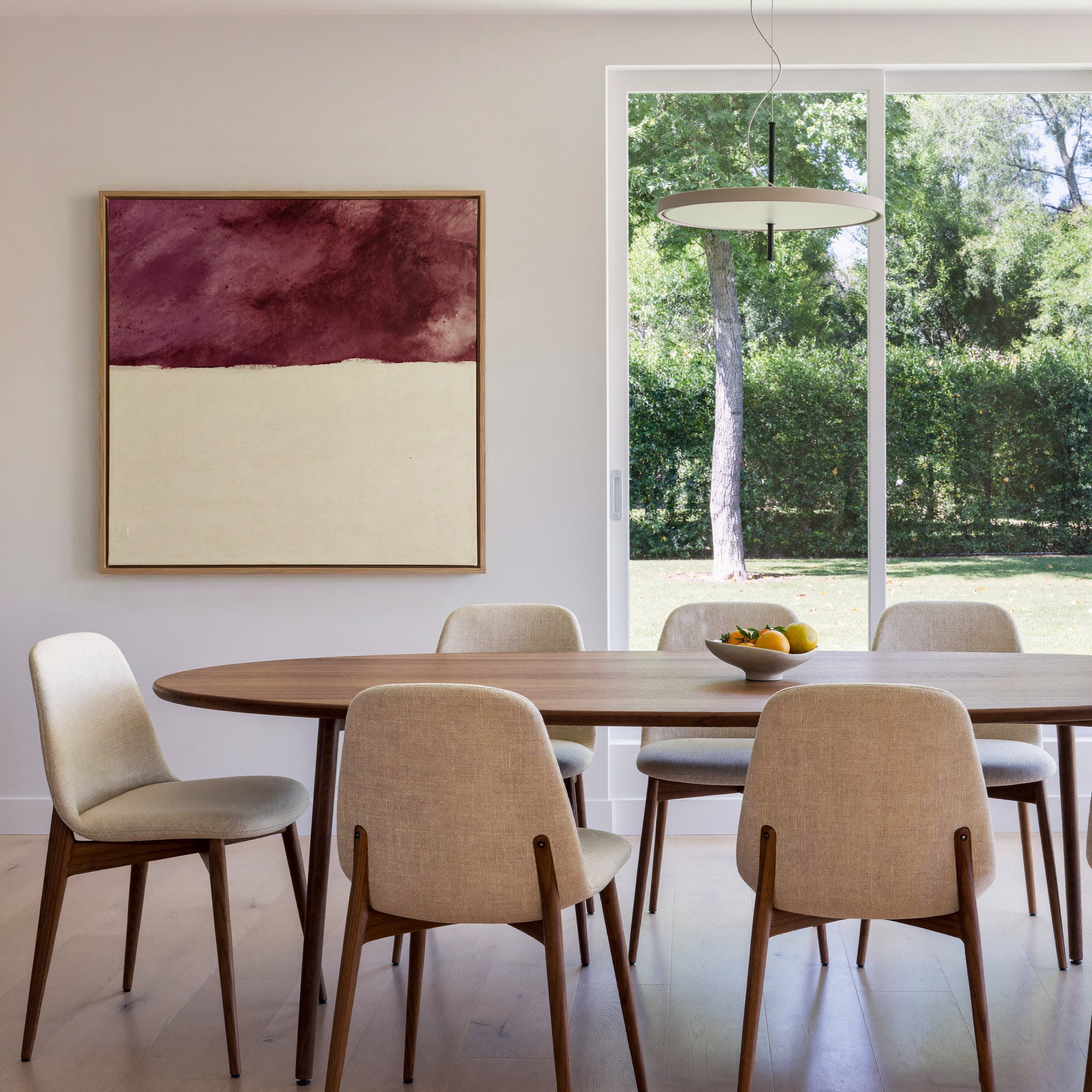 deep plum and cream abstract canvas wall art in an oak frame in a dining room