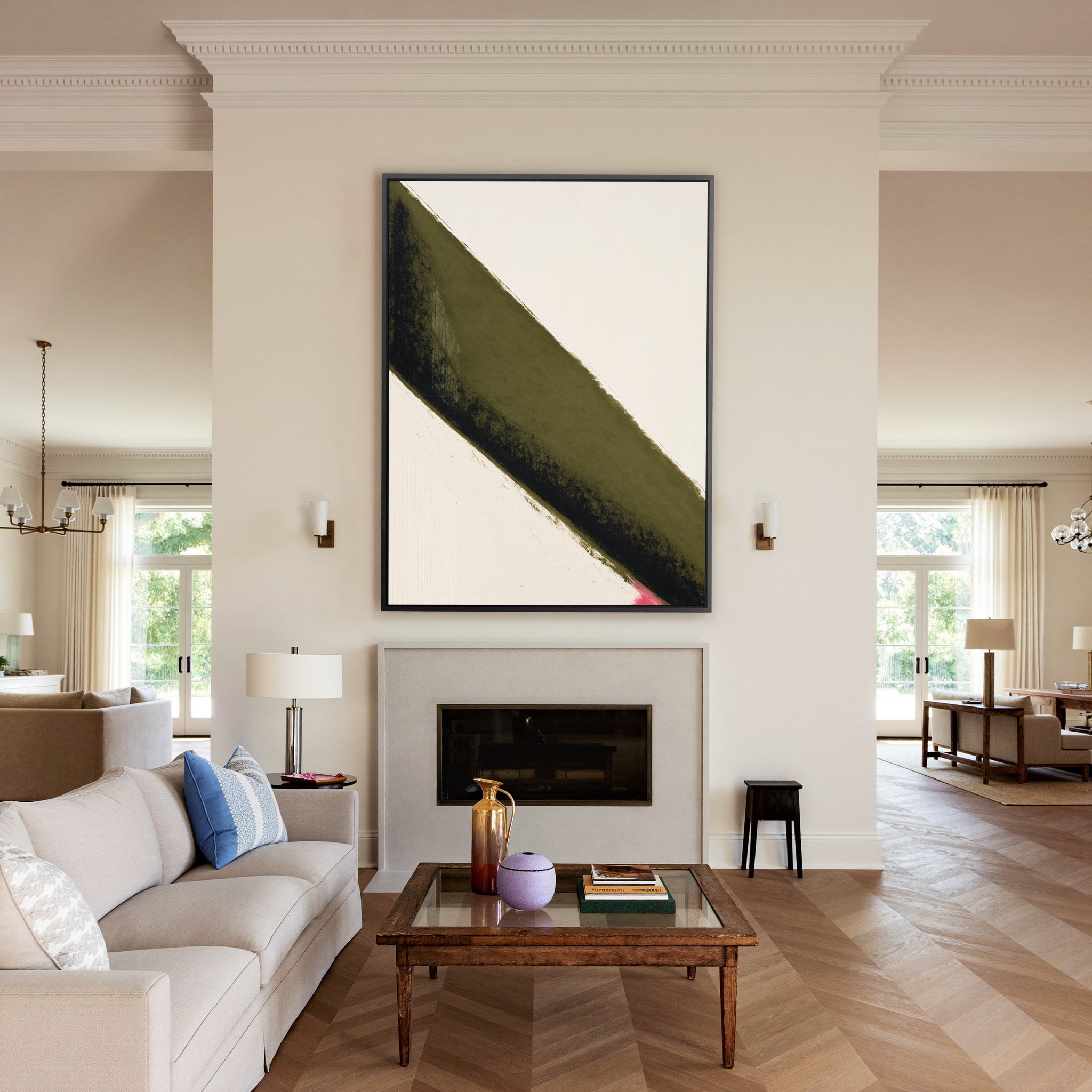 olive green diagonal band with black edge and canvas wall art in a black frame above a mantel