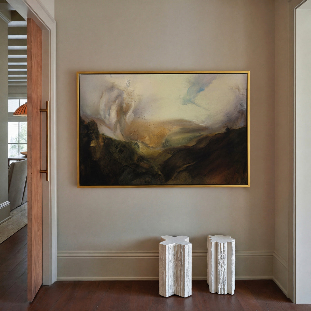 misty mountain landscape with dark foreground canvas wall art in a gold frame in a styled room setting