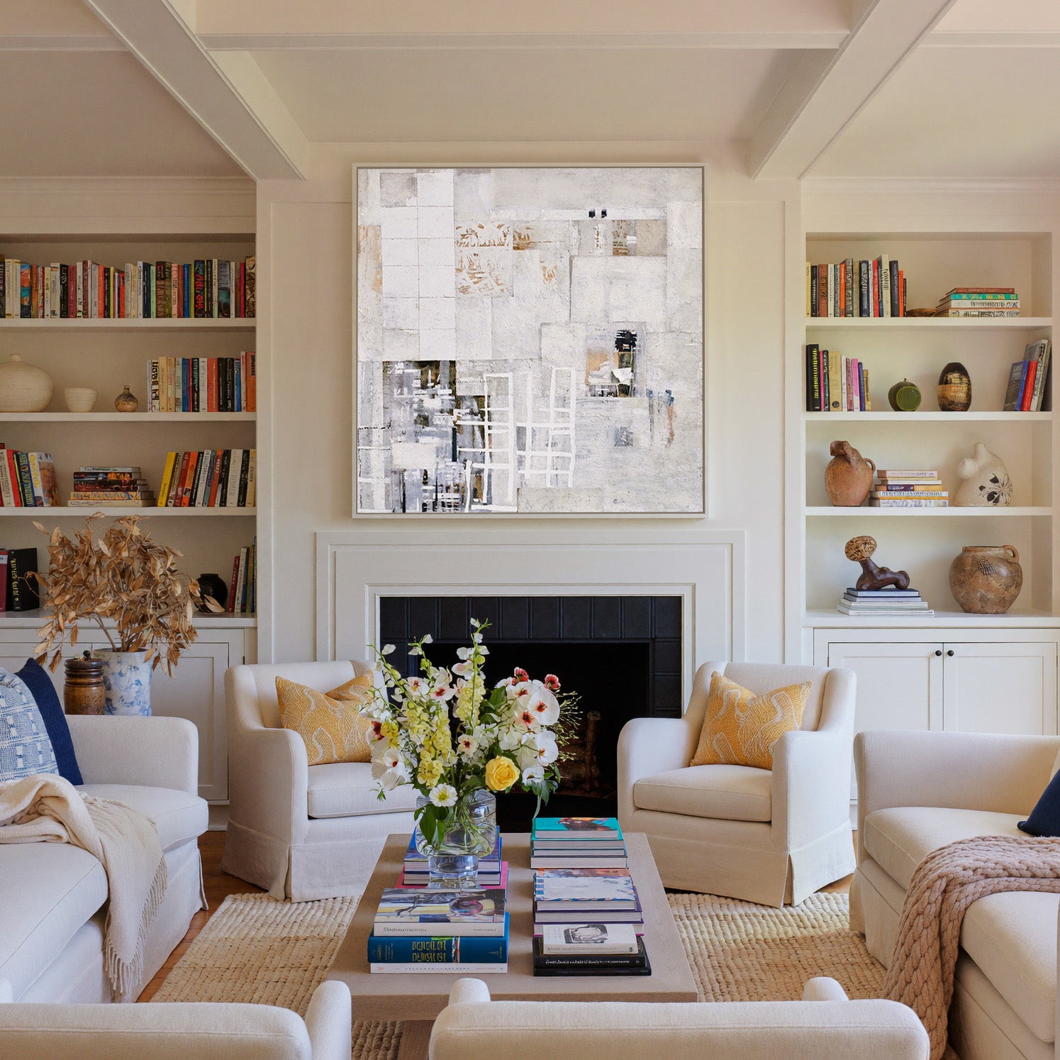 soft white and warm gray abstract with layered canvas wall art in a white frame above a fireplace