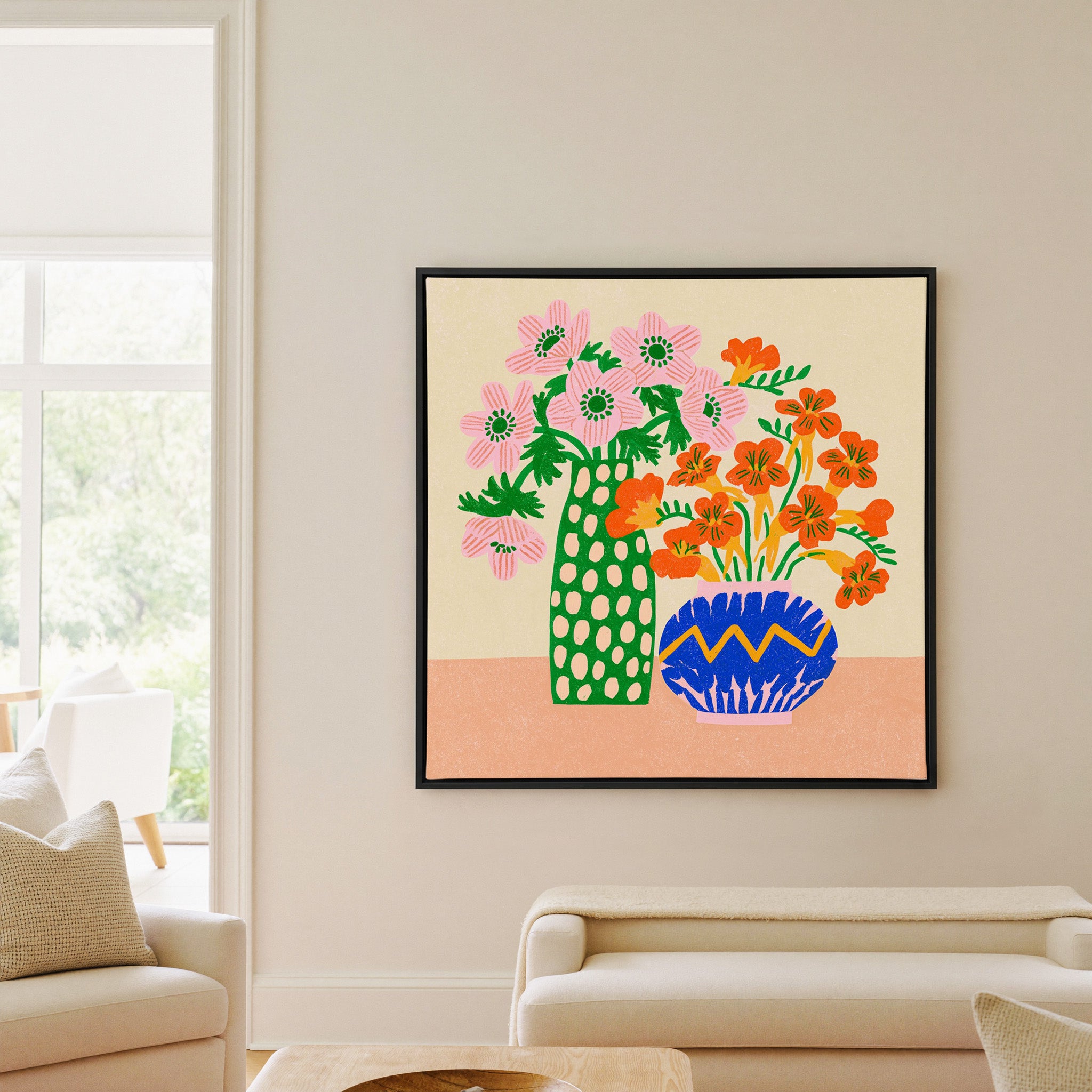 colorful folk still life with pink flowers, canvas wall art in a black frame in a living room