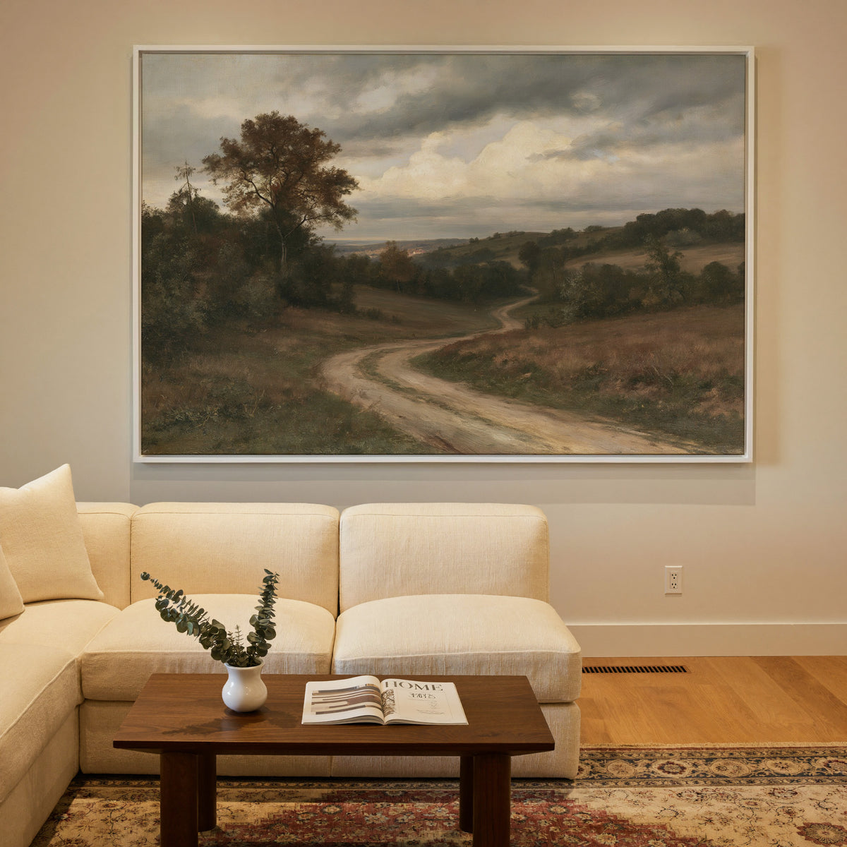 soft brown countryside with a winding dirt road canvas wall art in a white frame in a styled room setting