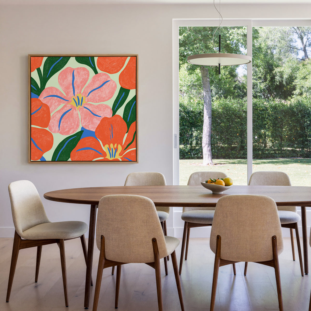 pink and orange floral abstract with blue canvas wall art in an oak frame in a dining room