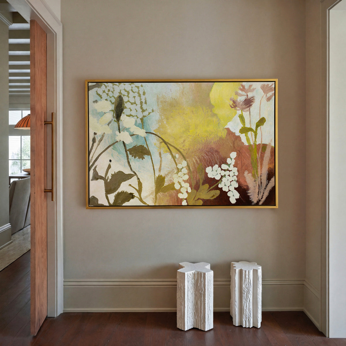 soft wildflower abstract with yellow, blush, canvas wall art in a gold frame in a styled room setting