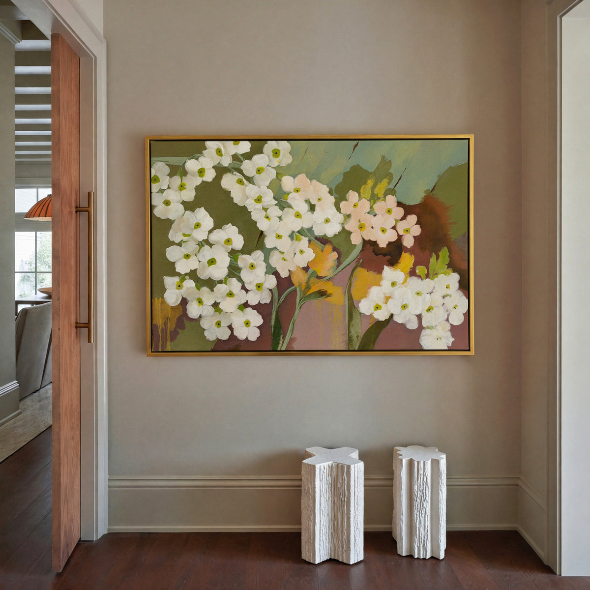 white and blush floral abstract with olive canvas wall art in a gold frame in a styled room setting