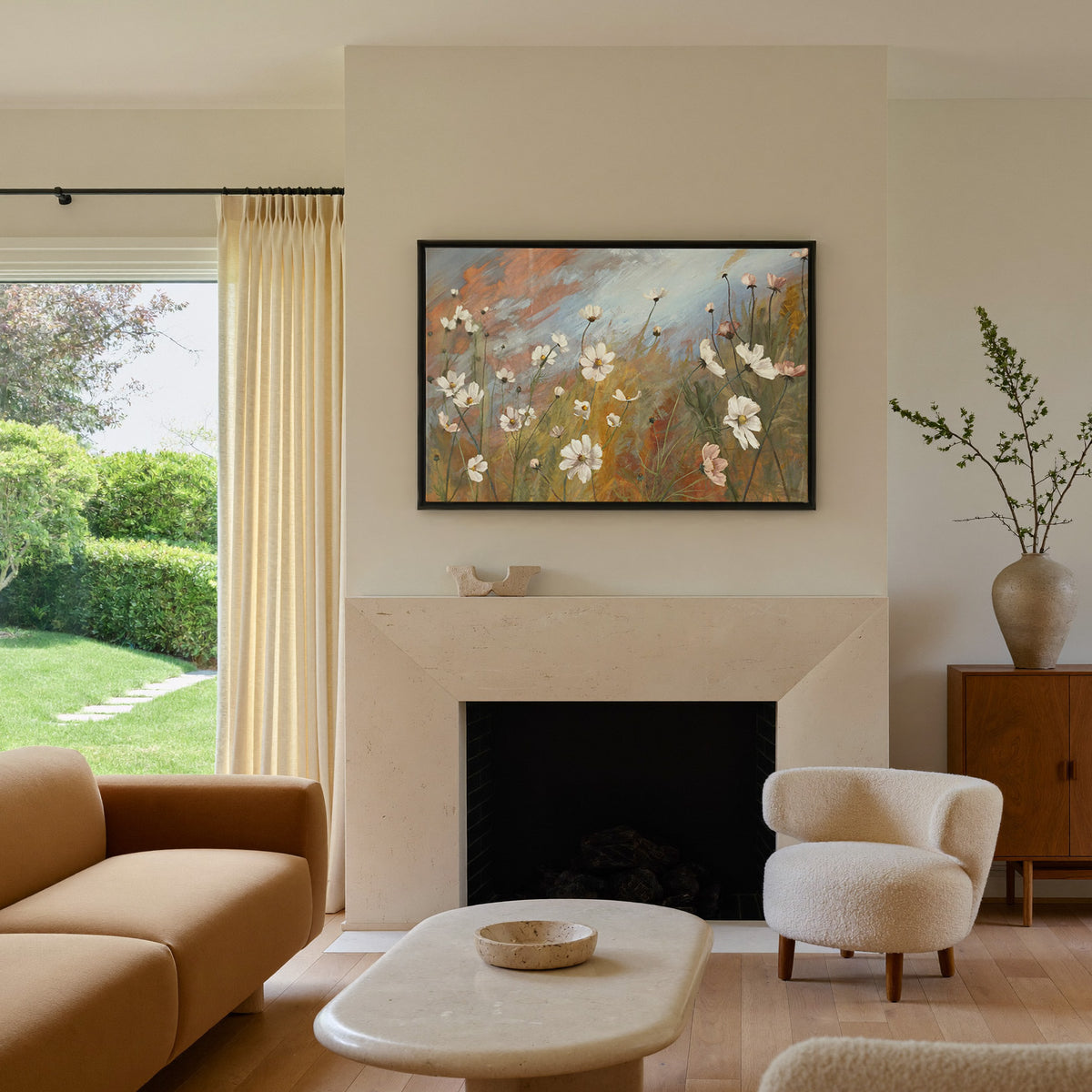 soft wildflower meadow with white and blush canvas wall art in a black frame above a mantel