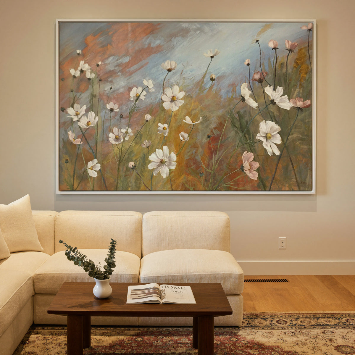 soft wildflower meadow with white and blush canvas wall art in a white frame in a styled room setting