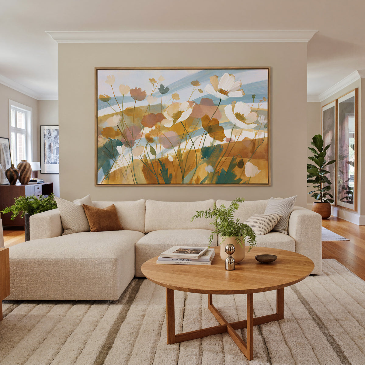 pale apricot poppies with blue bands canvas wall art in an oak frame in a living room