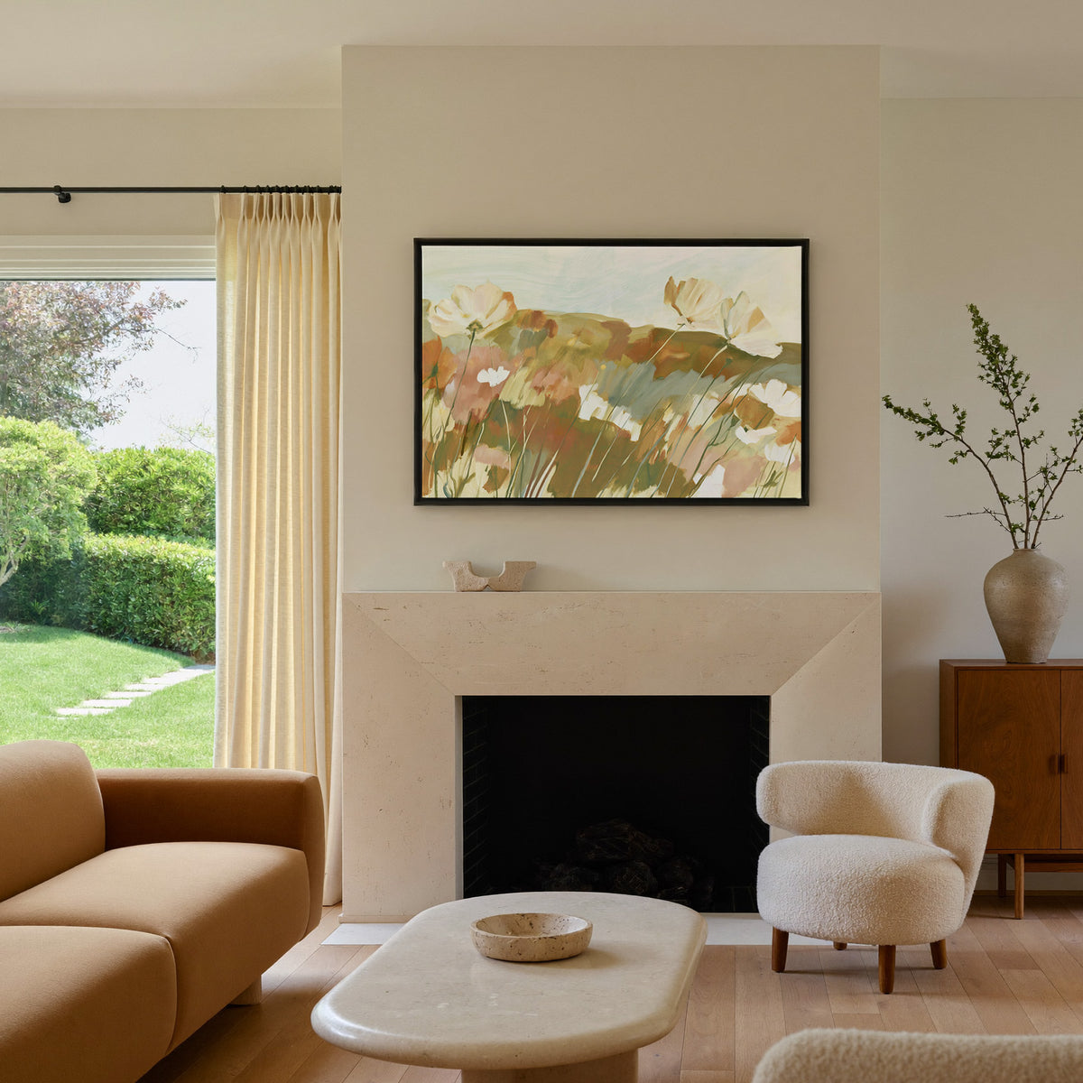 soft apricot poppies in a loose meadow canvas wall art in a black frame above a mantel
