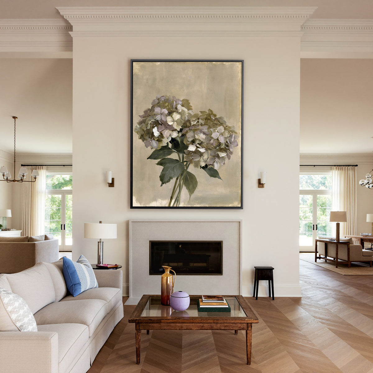 faded hydrangea cluster in cream, mauve, and canvas wall art in a black frame above a mantel