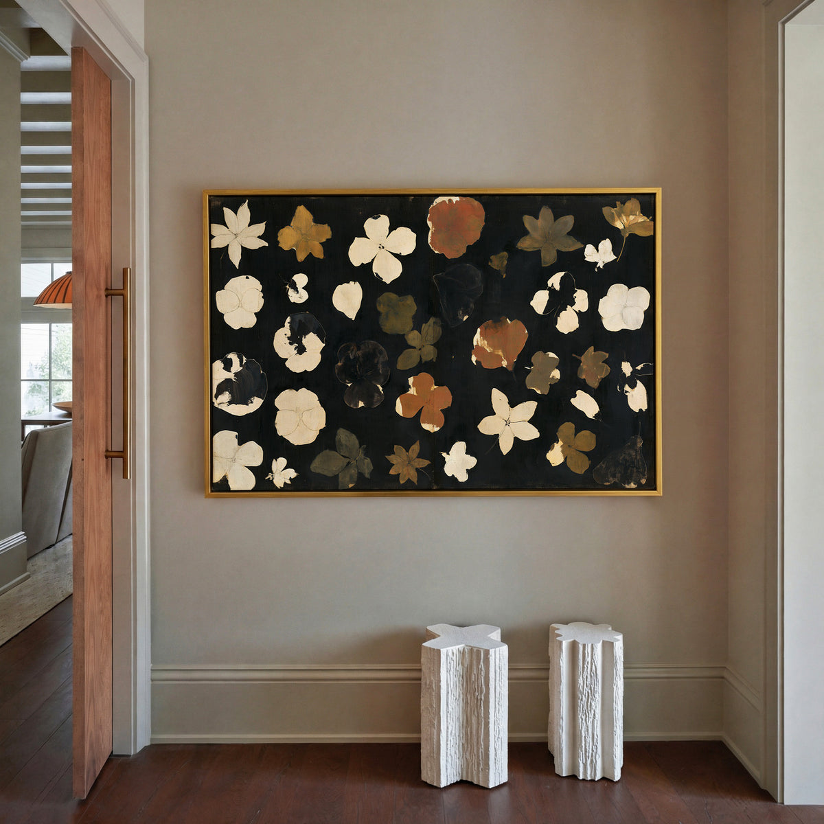 wild meadow flowers on a dark ground canvas wall art in a gold frame in a styled room setting